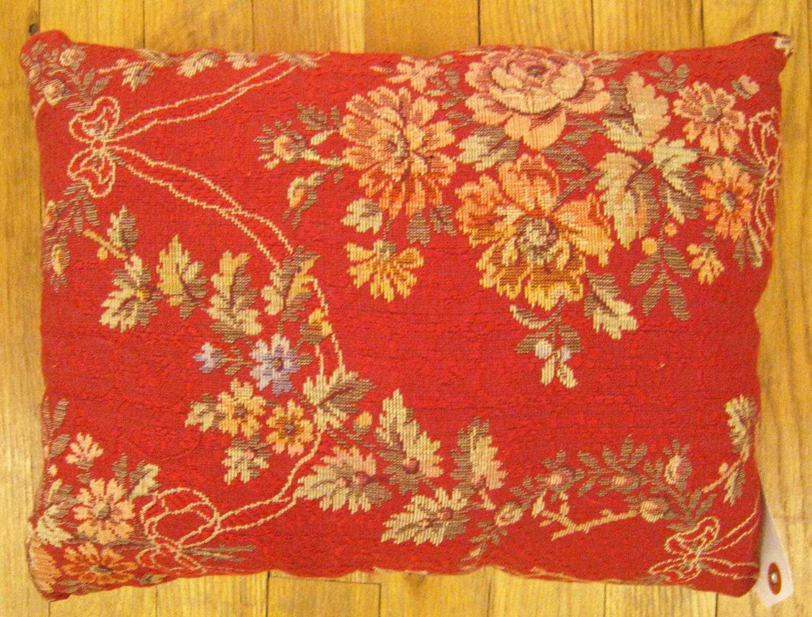 Antique Jacquard Tapestry Pillow; size 1'0” x 1'3”.

An antique decorative pillow with floral elements allover a red central field, size 1'0
