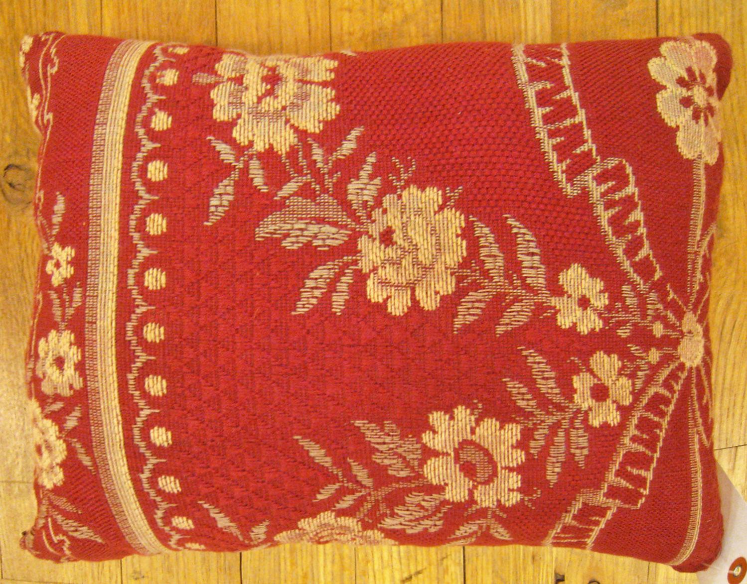 Antique Jacquard Tapestry pillow; size 1'0” x 1'2”.

An antique decorative pillow with floral elements allover a red central field, size 1'0