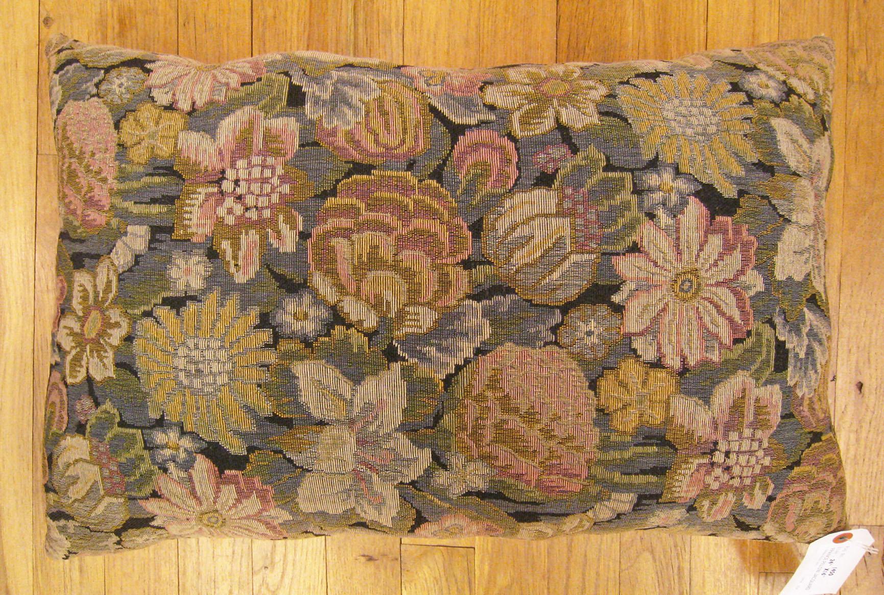 Antique Jacquard tapestry pillow; size 24” x 16” (2’ 0” x 1’ 4”).

An antique decorative pillow with floral elments allover a green central field, size 24” x 16” (2’ 0” x 1’ 4”). This lovely decorative pillow features an antique fabric on front