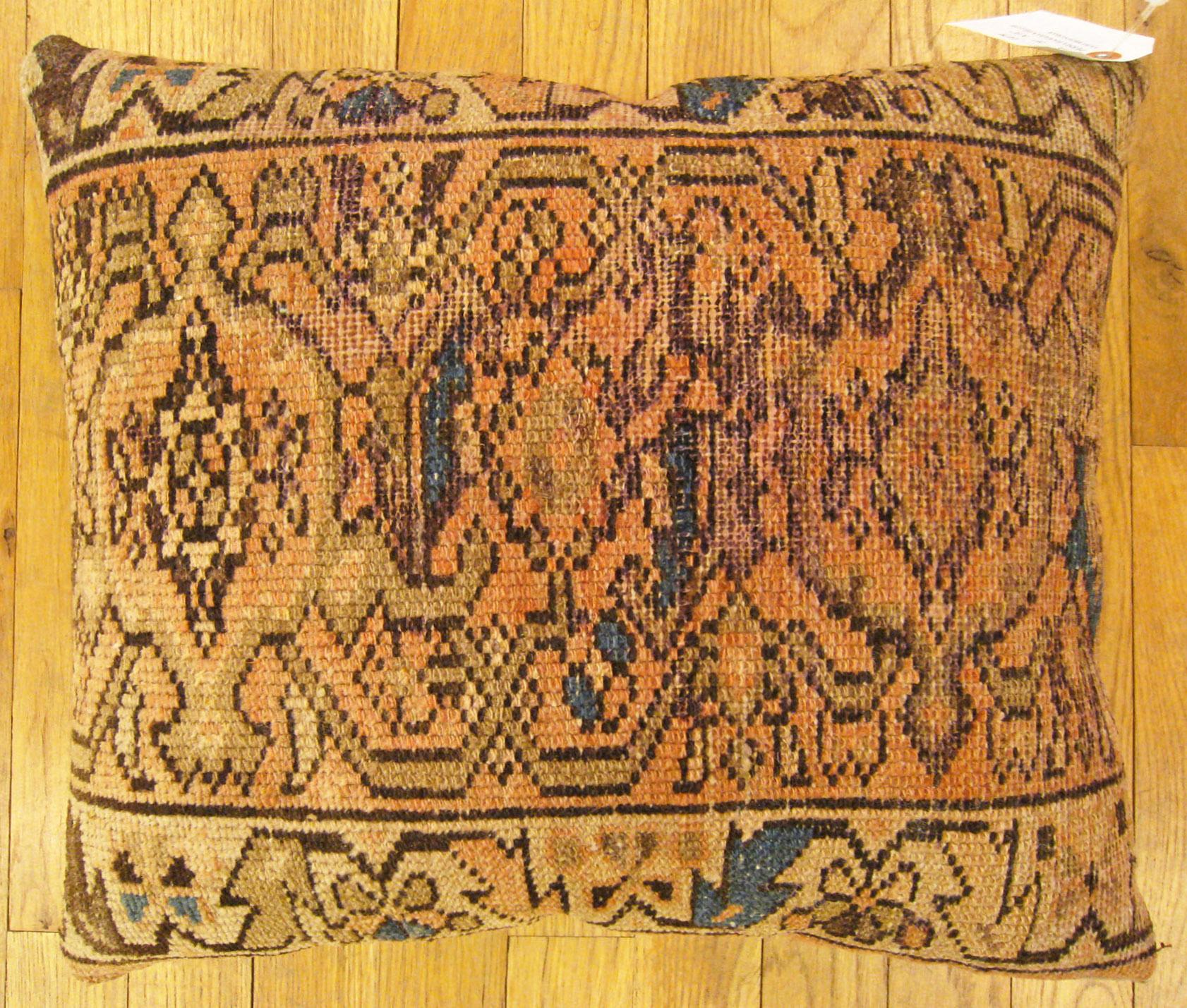 Antique Persian Hamadan Rug Pillow; size 1'8” x 1'4”.

An antique decorative pillow with geometric abstracts allover a light brown central field, size 1'8” x 1'4”. This lovely decorative pillow features an antique fabric of a Hamadan rug on front