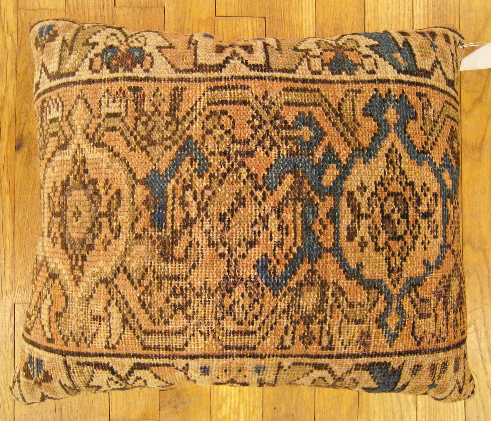 Antique Persian hamadan rug pillow; size 1'8” x 1'4”.

An antique decorative pillow with geometric abstracts allover a light brown central field, size 1'8” x 1'4”. This lovely decorative pillow features an antique fabric of a Hamadan rug on front