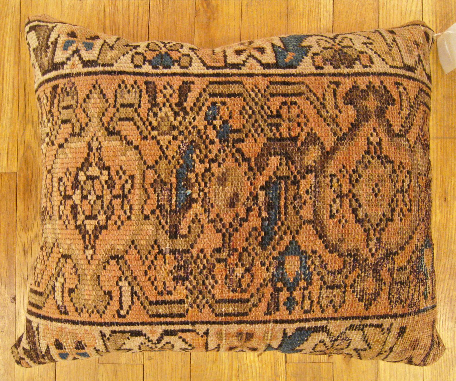 Antique Persian Hamadan Rug Pillow; size 1'8” x 1'4”.

An antique decorative pillow with geometric abstracts allover a light brown central field, size 1'8” x 1'4”. This lovely decorative pillow features an antique fabric of a Hamadan rug on front