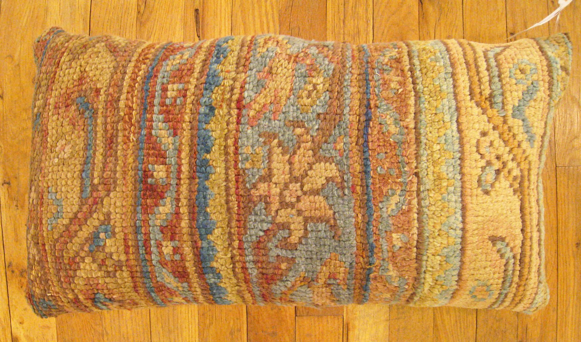 Antique Turkish Oushak Rug Pillow; size 2'0” x 1'3”.

An antique decorative pillow with geometric abstracts motif in a lbeige central field, size 2'0” x 1'3”. This lovely decorative pillow features an antique fabric of a Turkish Oushak rug pillow on