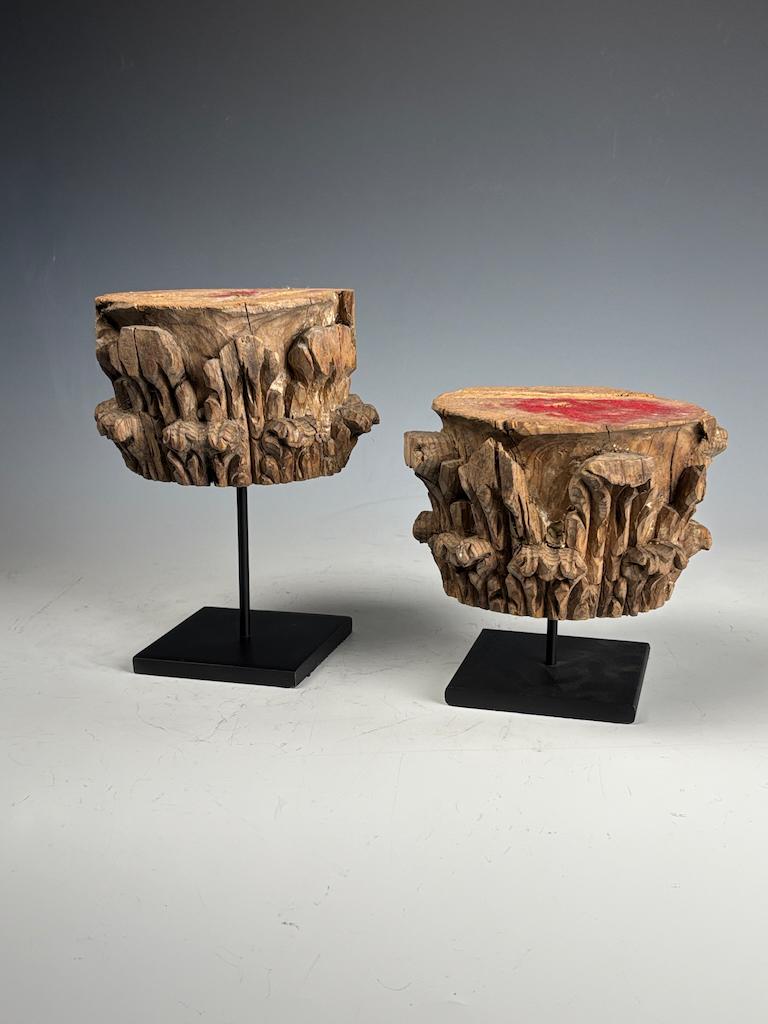 Decorative Antique Wooden Stands – Pair of Carved Corinthian Capitals
This striking pair of antique carved Corinthian capitals has been repurposed into decorative wooden stands, mounted on elegant black metal bases. Crafted from solid wood and