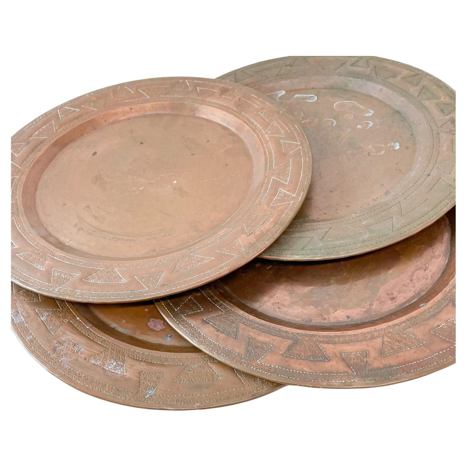 Copper plates
Aztec design engraved vintage copper plates set of four
Measures: 11.75 in diameter x .5 height per plate
Preowned unrestored vintage condition. Patinated.
No label or stamp.
Refer to images.

   