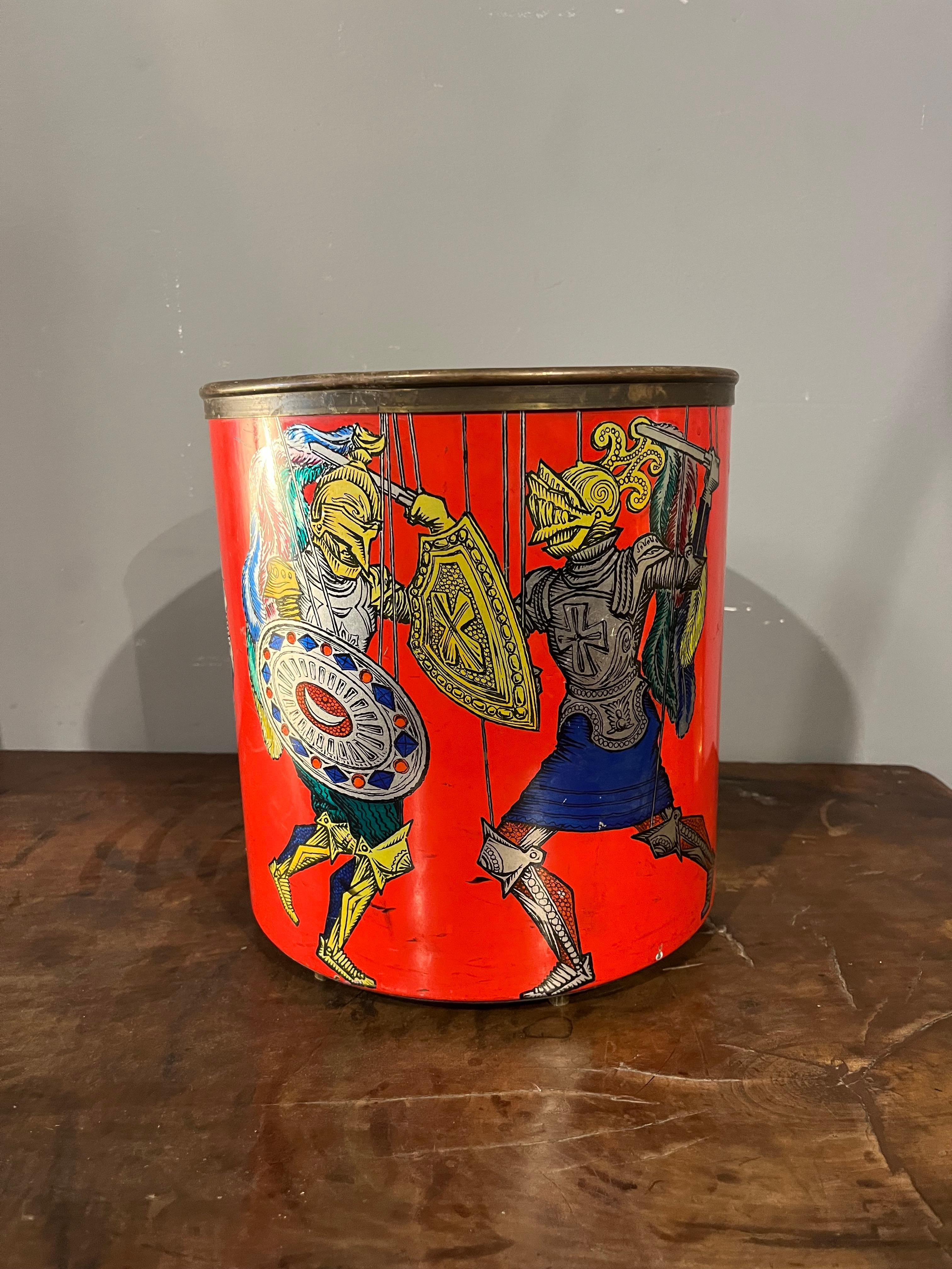 For sale is a rare and fascinating vintage basket by Fornasetti, an authentic masterpiece of twentieth-century Italian design. The object, immediately recognizable by its very lively decoration, features a medieval-style chivalric scene, with two