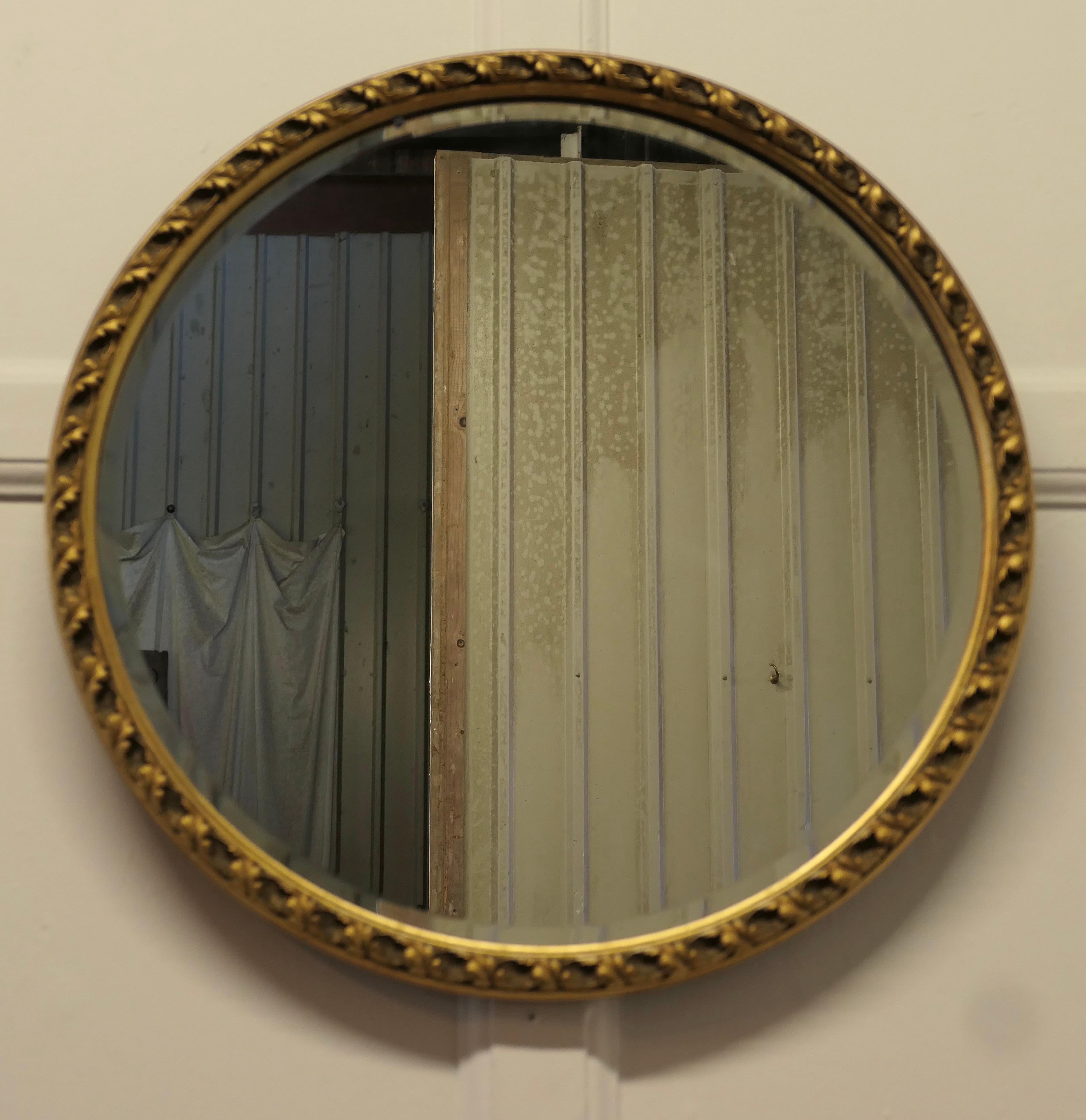 Decorative Bevelled Gilt Round Wall Mirror 

This is a very attractive Mirror has a 1” wide gilt frame which is deeply moulded and has a beveled looking glass 
The mirror frame is in good condition as is the original looking glass

The mirror