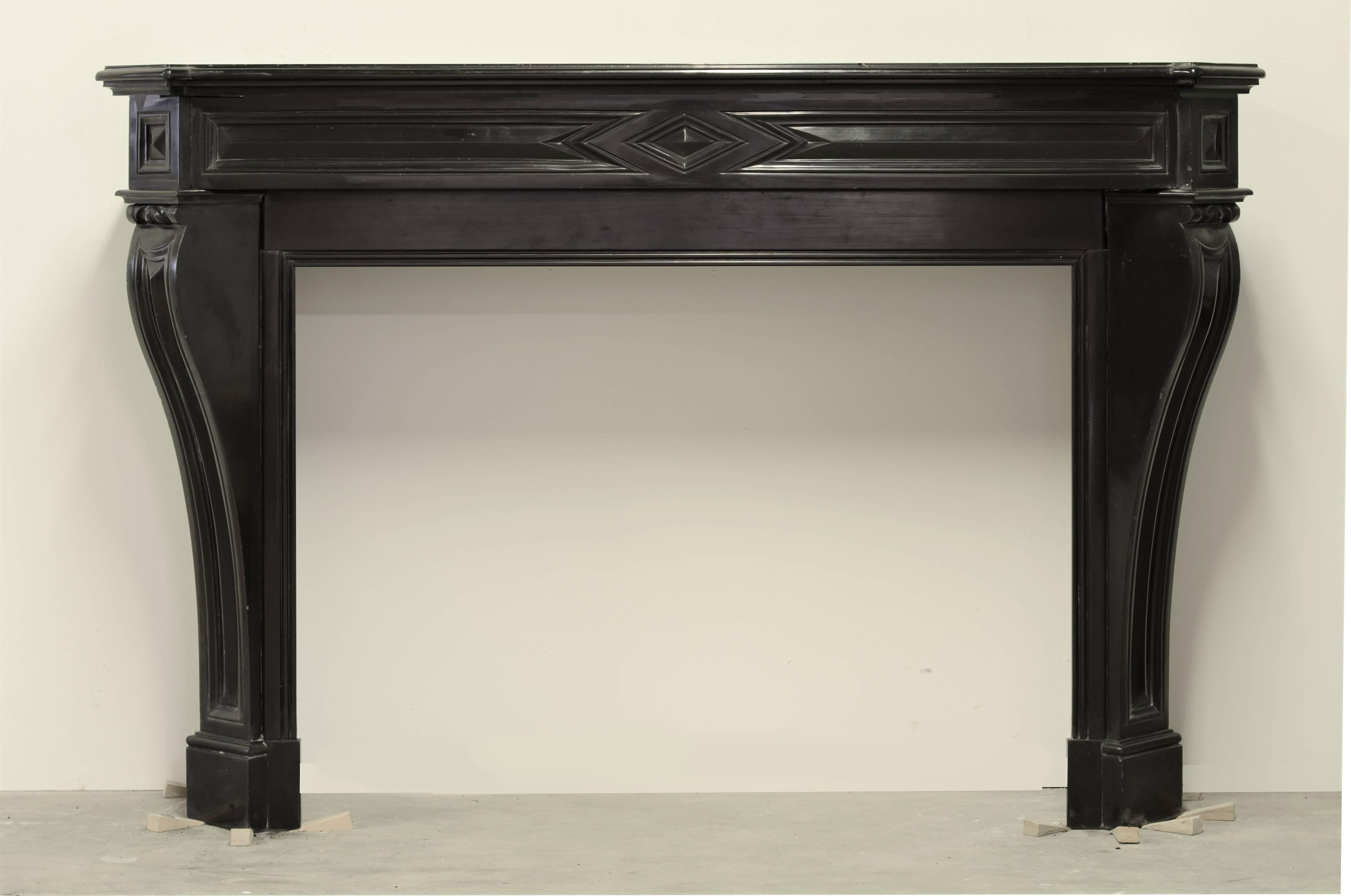 A very nice French Louis XVI style fireplace mantel mad from deep black Belgian marble.
The size an proportions make this piece very suitable for a smaller room.

Opening is 29.13 inch (74 cm)  high and 39.37 inches (100 cm) wide.

Marble floor not