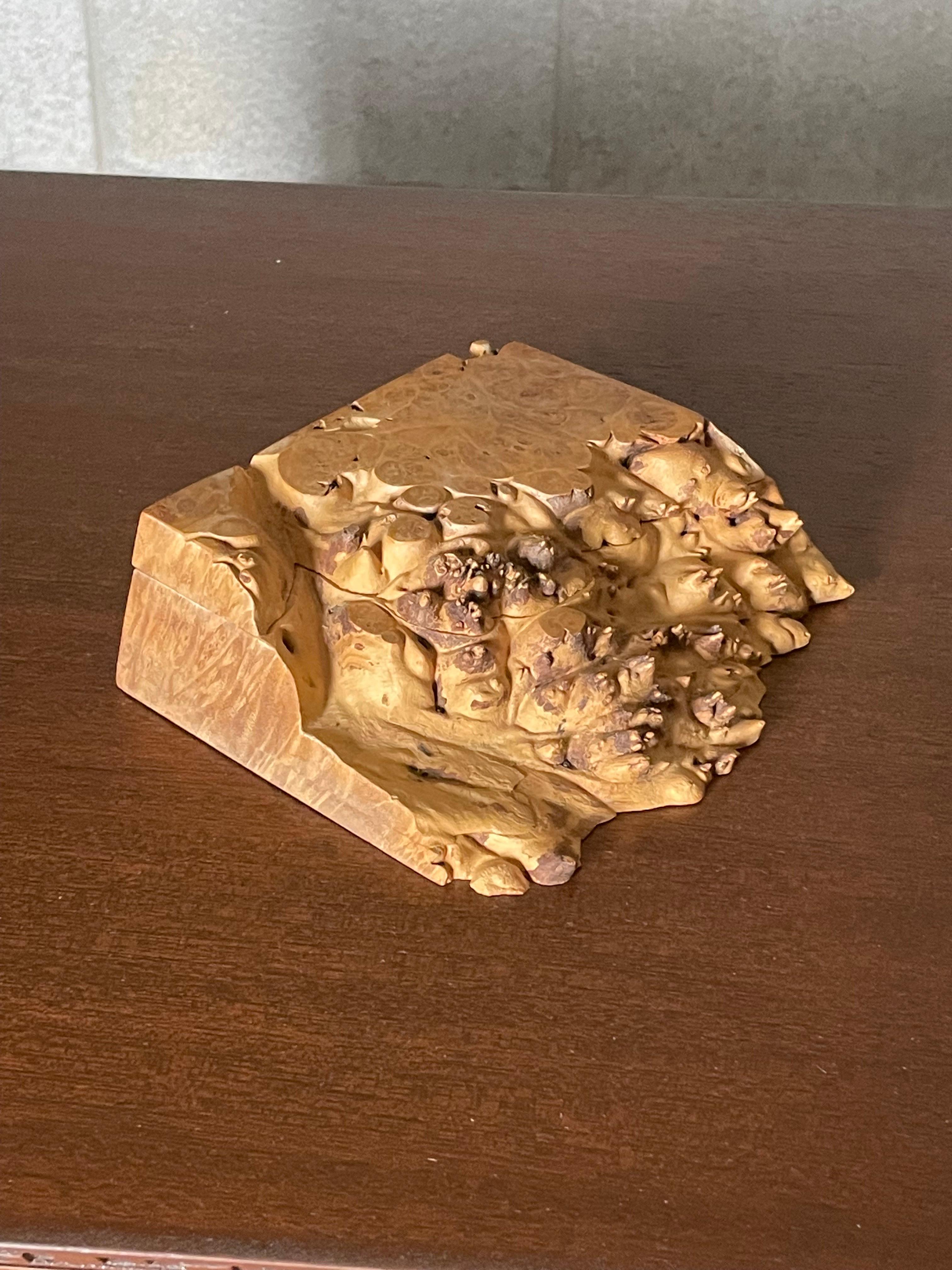A wonderful lidded box made by Michael Elkan from Oregon Birdseye Maple Burl. Box features a live edge front with great movement. Lid is not hinged like many of his other boxes and is completely removable. Box is signed on underside and comes
