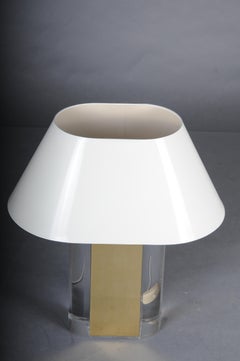 Decorative brass and acrylic table lamp in Hollywood Regency style.