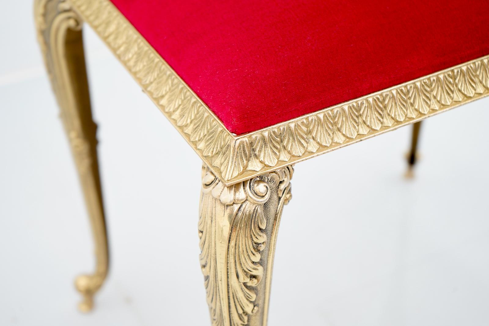 Very decorative brass stool with a red velvet fabric. Very good condition.