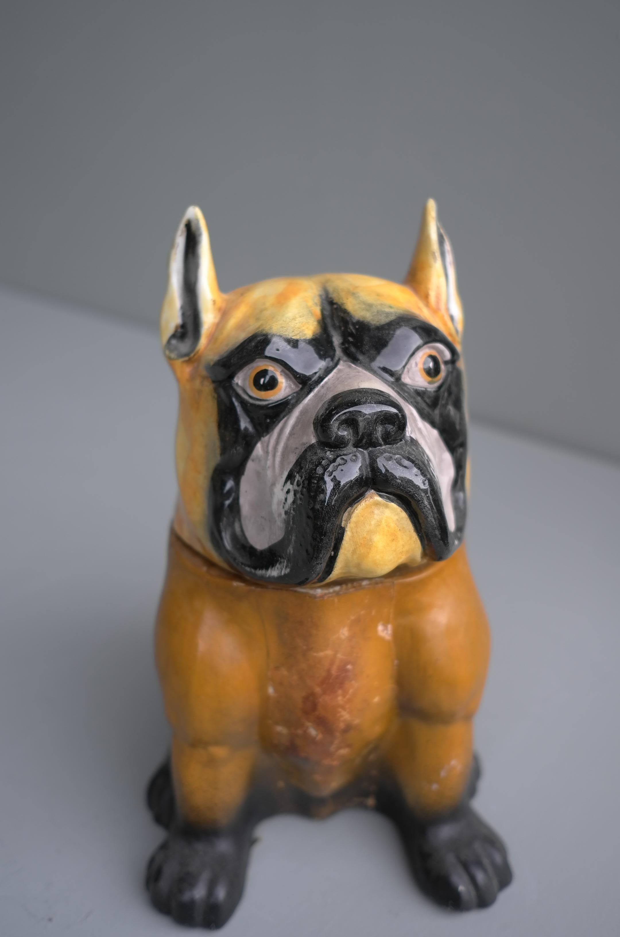 Decorative bulldog glazed ceramic and leather sculpture cookie jar, 1960s

The head is Ceramic glazed the body ceramic and leather with paint.
It can also function as Cookie Jar or storage small things.