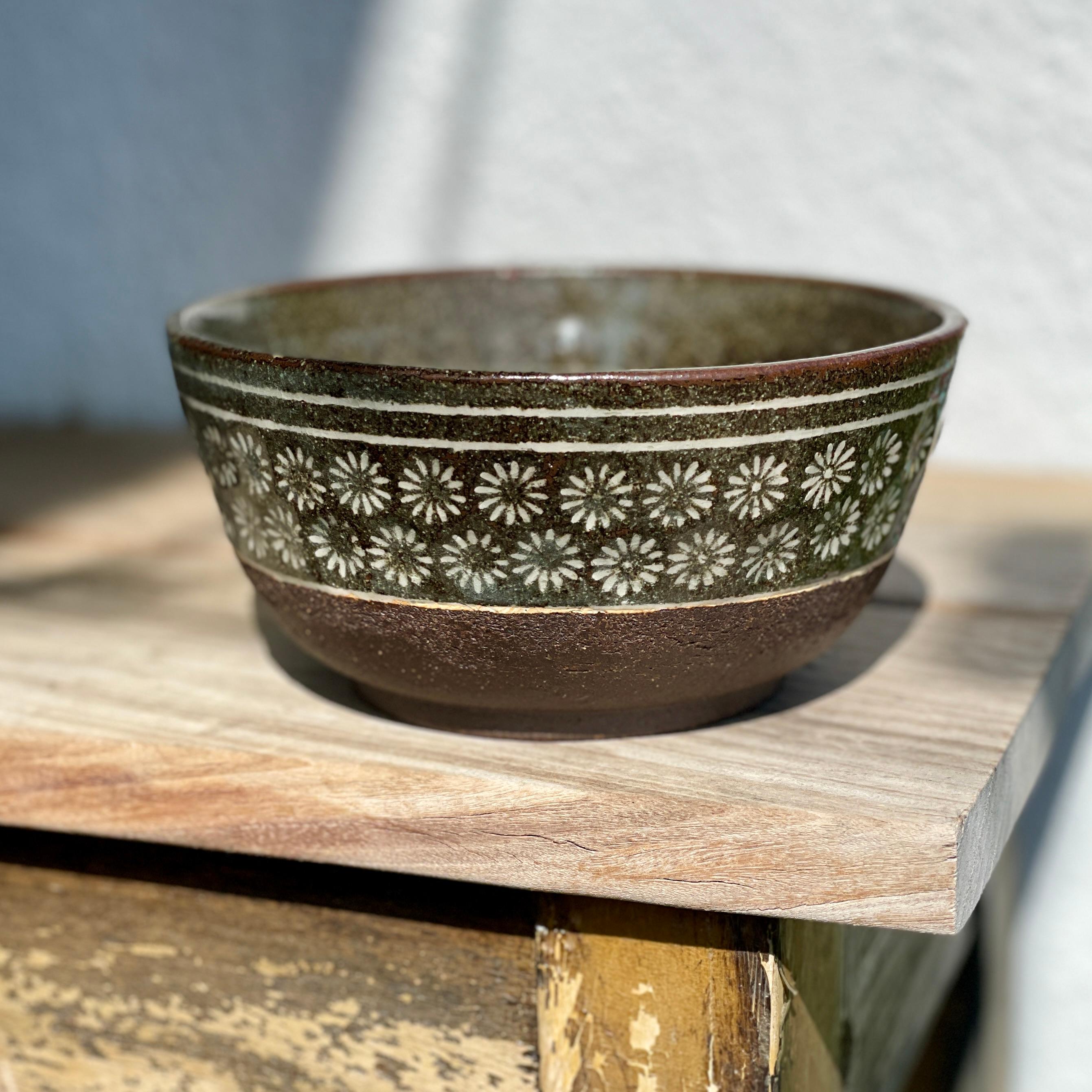Decorative Buncheong Flower Bowl by Jason Fox.

A Southern Californian for over half his life, Contemporary Ceramic Artist Jason Fox draws upon his classical education in Architecture and Art History as well as his love of surfing and the ocean. He