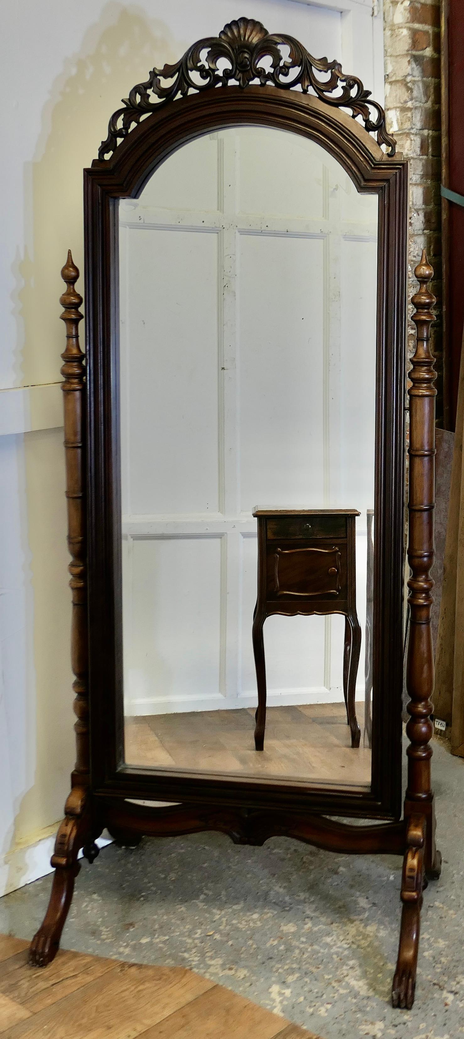 Decorative Carved Cheval Dressing Mirror

This lovely Mirror has a Shell and Acanthus pierced carved top, it sits firmly in its stand and swivels for maximum advantage
The Stand has carved Lions feet with delicately turned upright supports, the