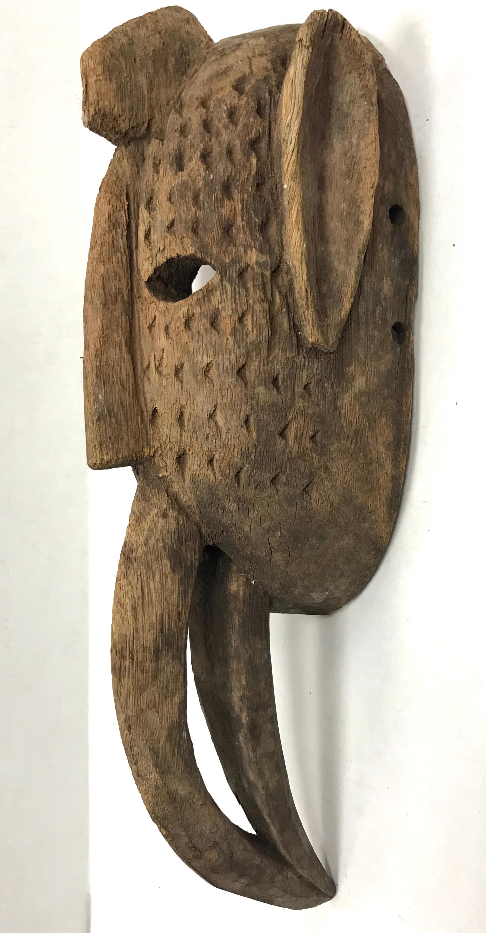 Magnificent Ghana, Africa carved Primitive tribal mask hanging sculpture. All original and part of a collector's collection of rarer pieces from the middle of the 20th century.