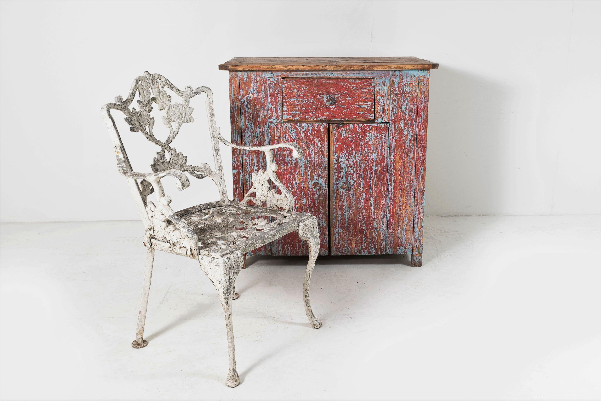 A very decorative cast aluminium garden armchair with lovely flaky paint and weathered to perfection.
The is a heavy cast frame, very well made and dates to circa 1940s when cast aluminium started to be used due to shortage of cast iron during the