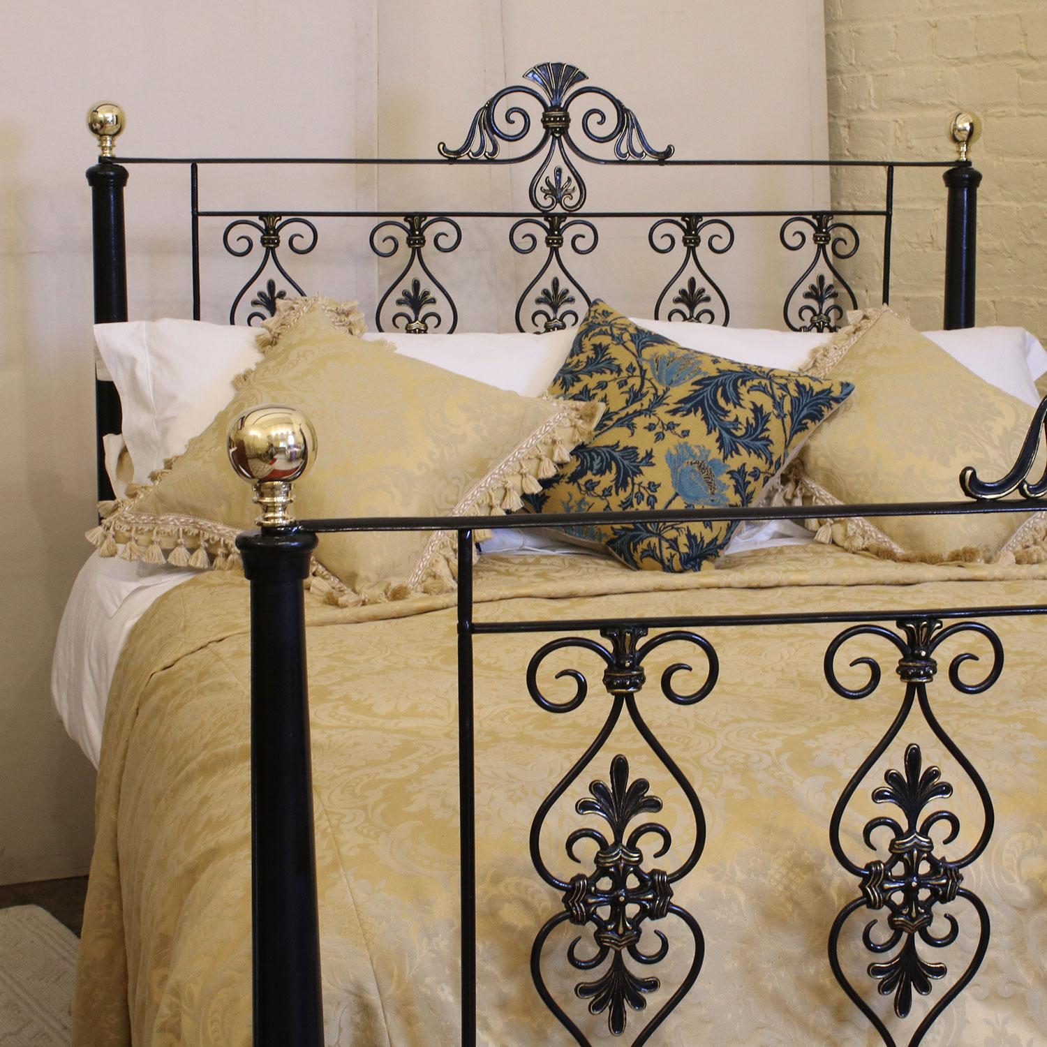Mid-Victorian cast iron bedstead with magnificently cast decorative panels which have been hand gold-lined to highlight the splendid workmanship of this period.