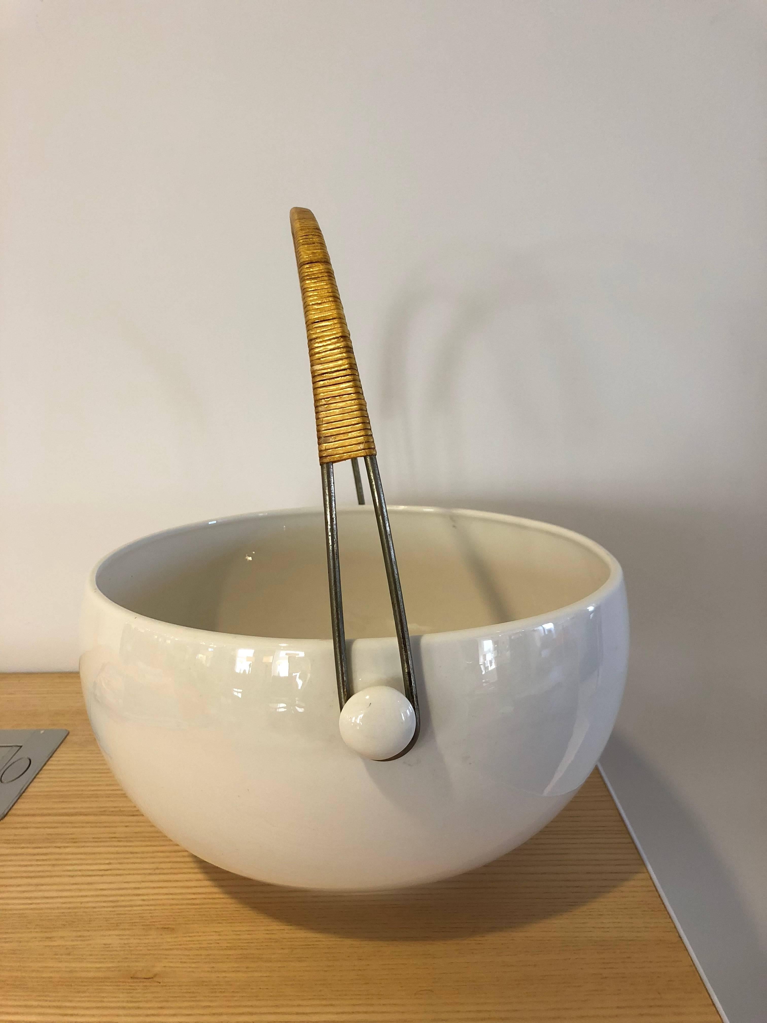 1960s ceramic bowl with cane wrapped handle.
