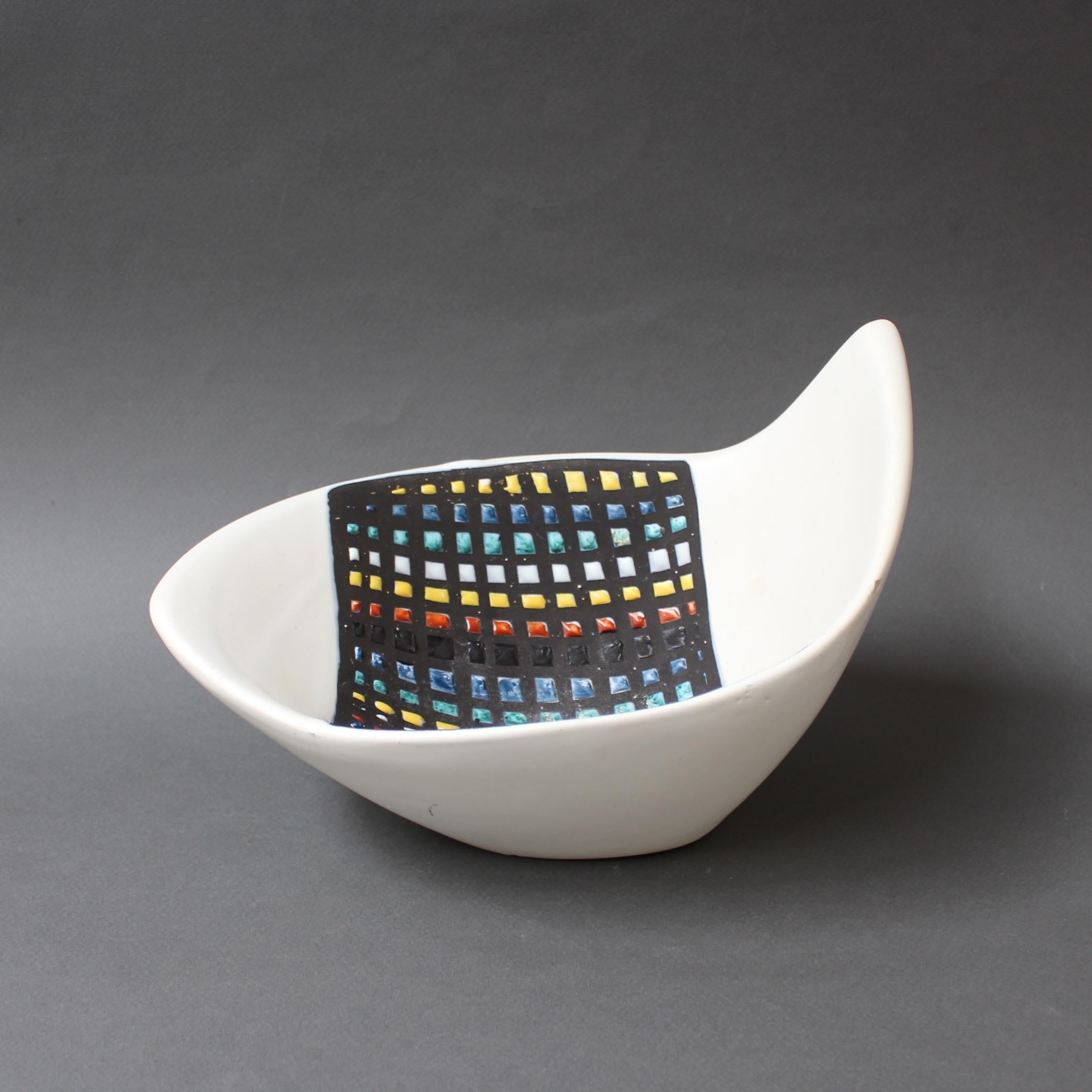 A decorative ceramic bowl by artist Roger Capron (1922 - 2006) who founded the craft-based workshop in Vallauris, France, l'Atelier Callis. Capron's creations contributed to a veritable renaissance of pottery and ceramics in that era and he left