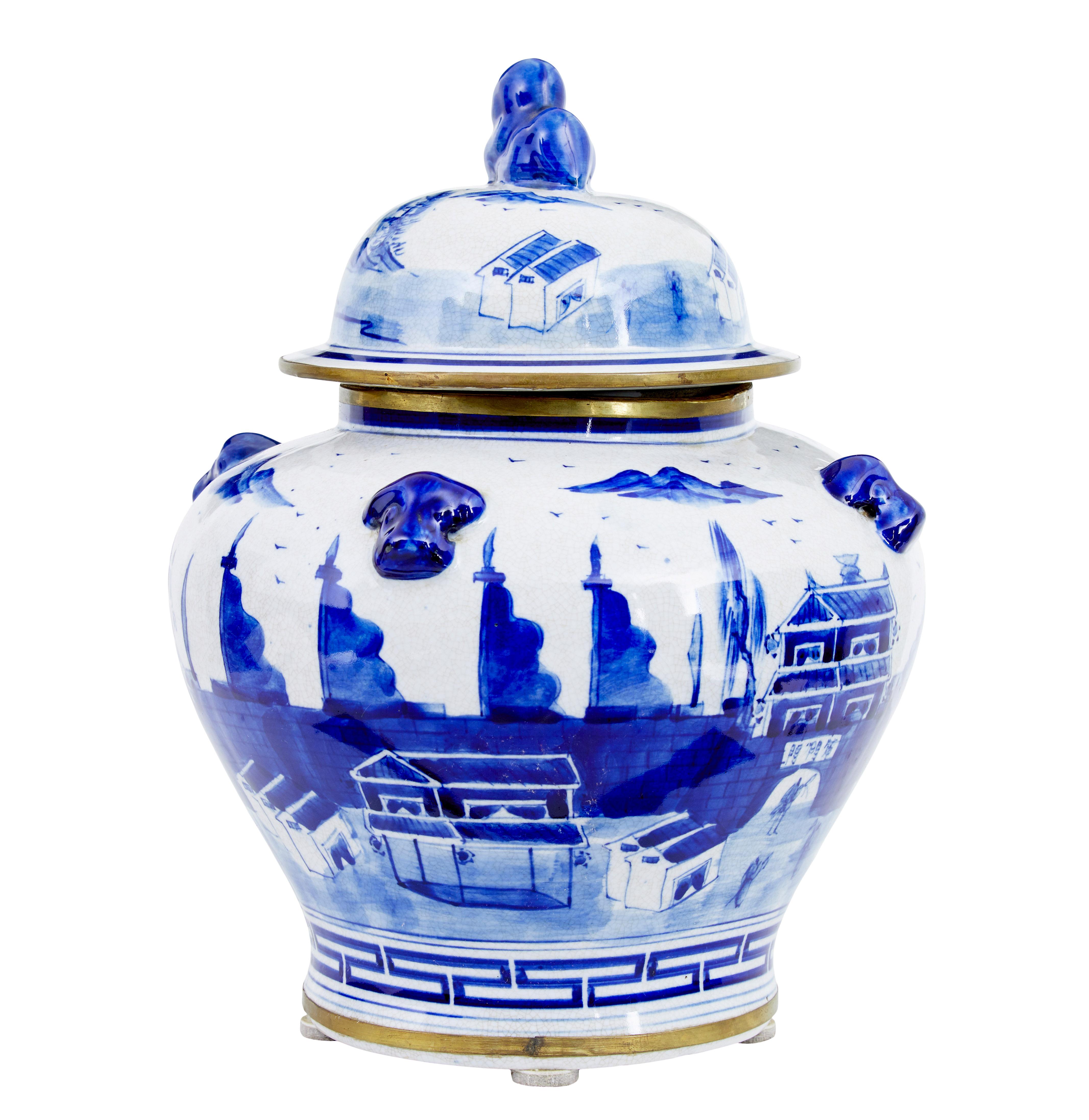 Decorative ceramic ginger jar circa 1960.

Good quality small Chinese ginger jar.  Hand painted in blue on a white background, further decorated with gilt rim and bottom edge.

Good condition.  Rim to top of jar is wonky but lid sits fine on it.