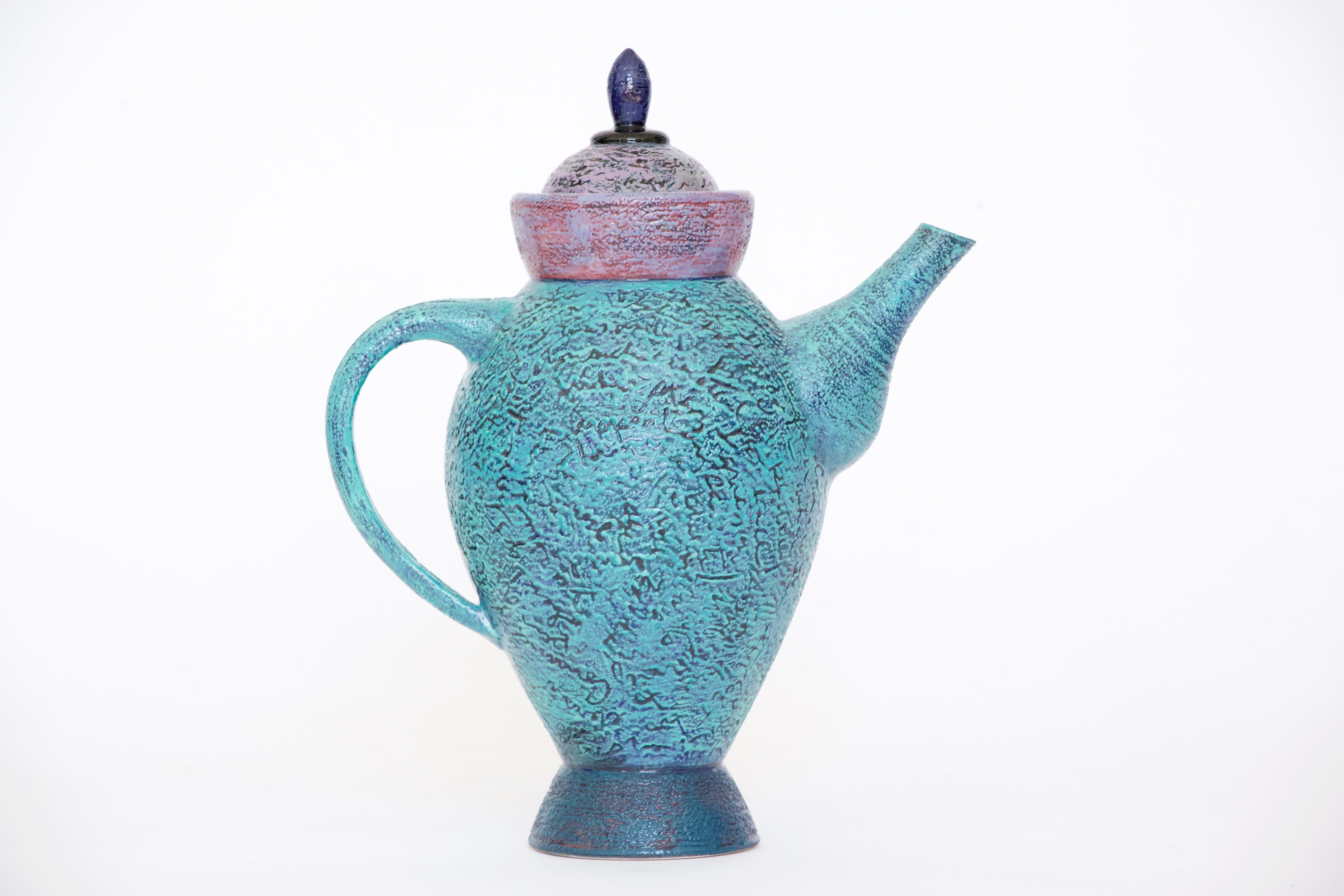 A wonderful signed and numbered decorative ceramic teapot by artist Michel Conroy. Conroy's artworks are included in the collections of the San Angelo (TX) Museum of Fine Arts, the University of Georgia, Athens, Yeoju Institute of Technology, Yeoju,
