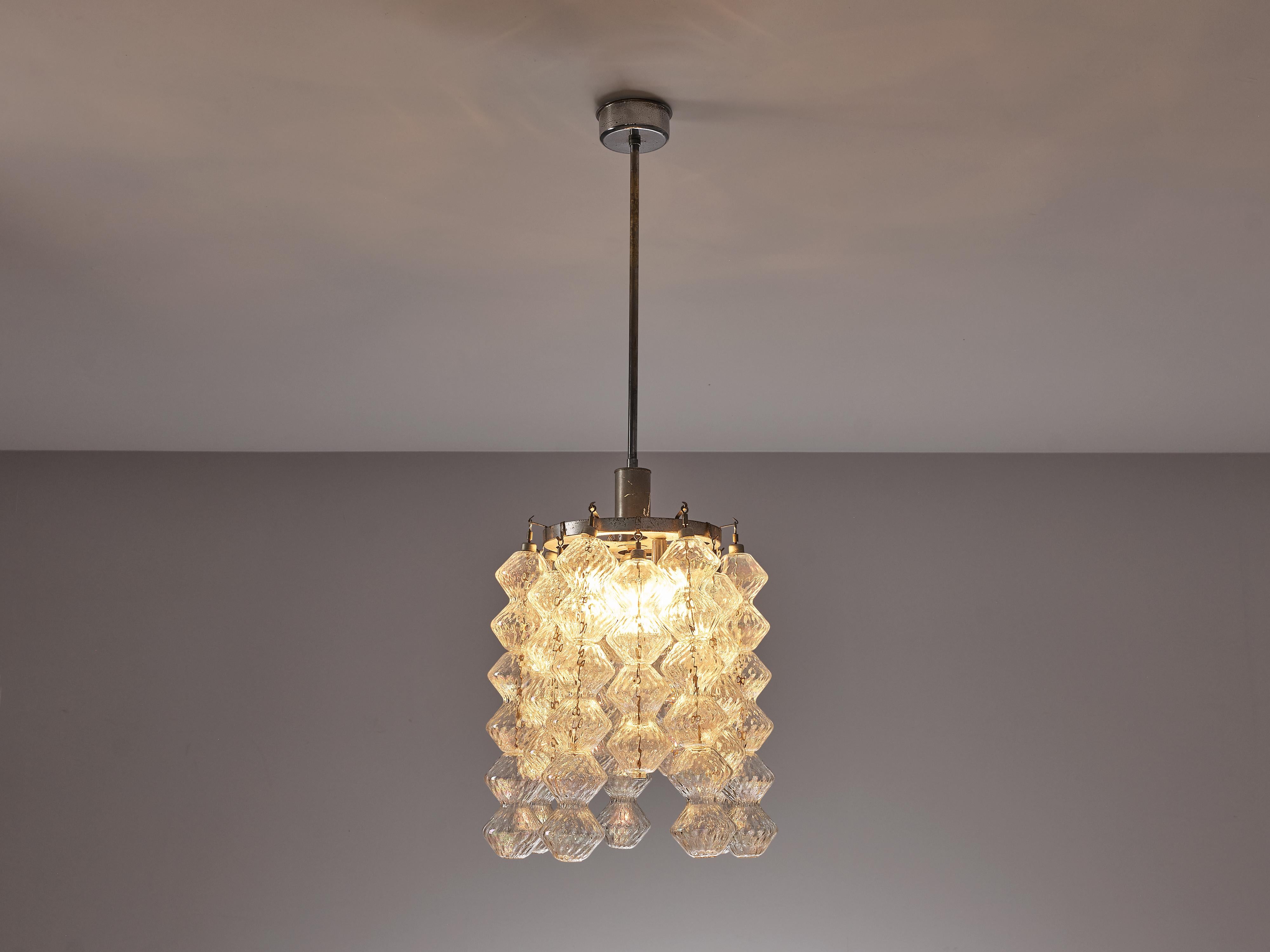 Chandelier, chrome, glass, Europe, 1960s 

This beautiful chandelier is decorated with elongated textured glass spheres that absorb the light. This results in an alluring partition of light adding a lovely atmosphere in the room. The chrome of the