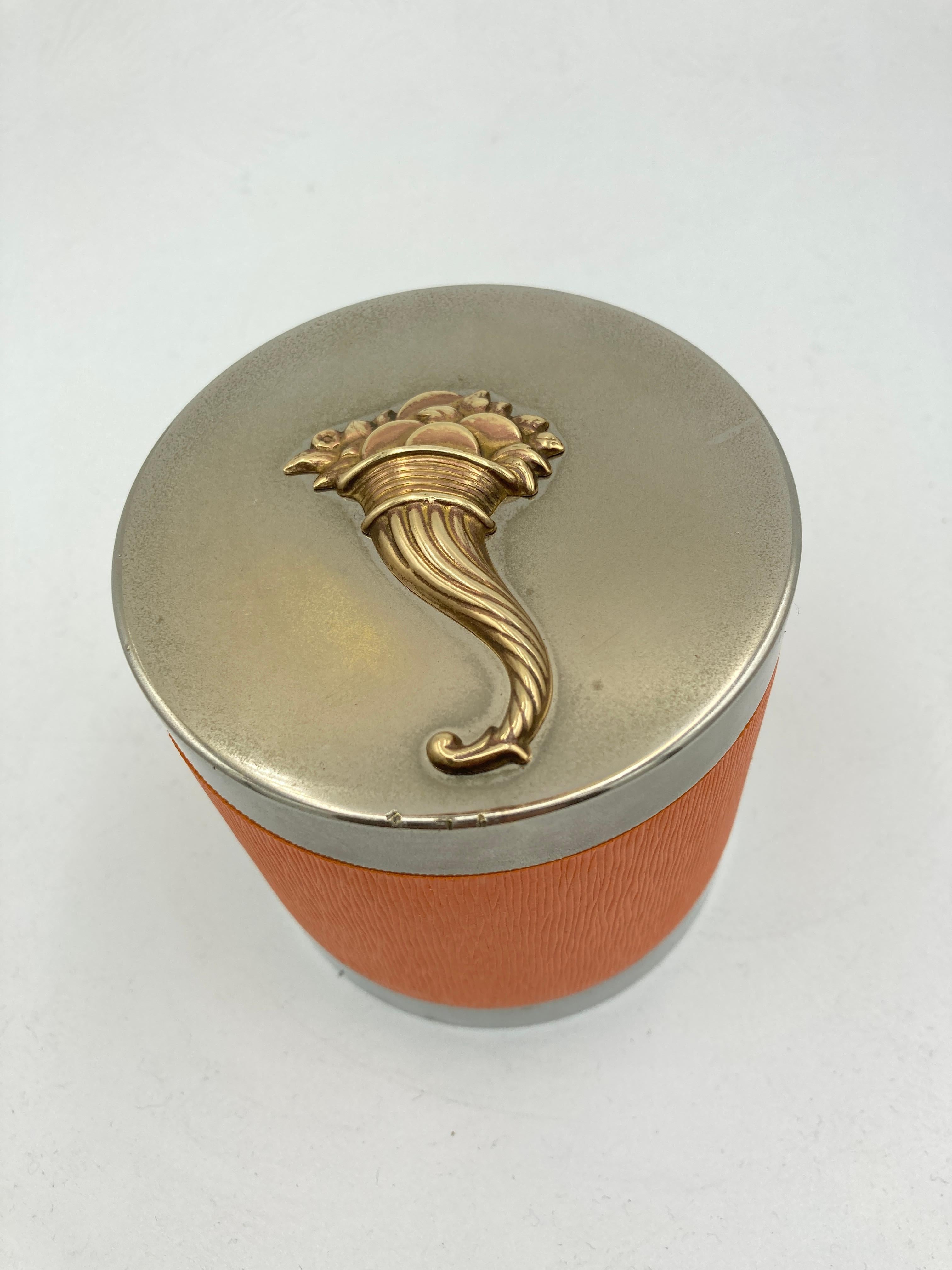 Very nice cigaret  boxe with orange leather decorated with a horn of abundance
signed Hermes Paris