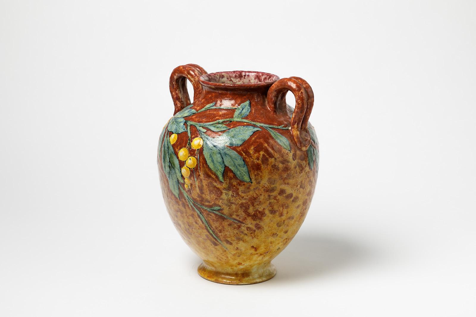 Henry Chaumeil

Signed and dated 1912

Elegant art decorative ceramic vase by French artist.

Orange, yellow and green ceramic glazes colors.

Fruits and olive branch decoration.

Measures: Height 28cm, large 23cm, depth 20cm.