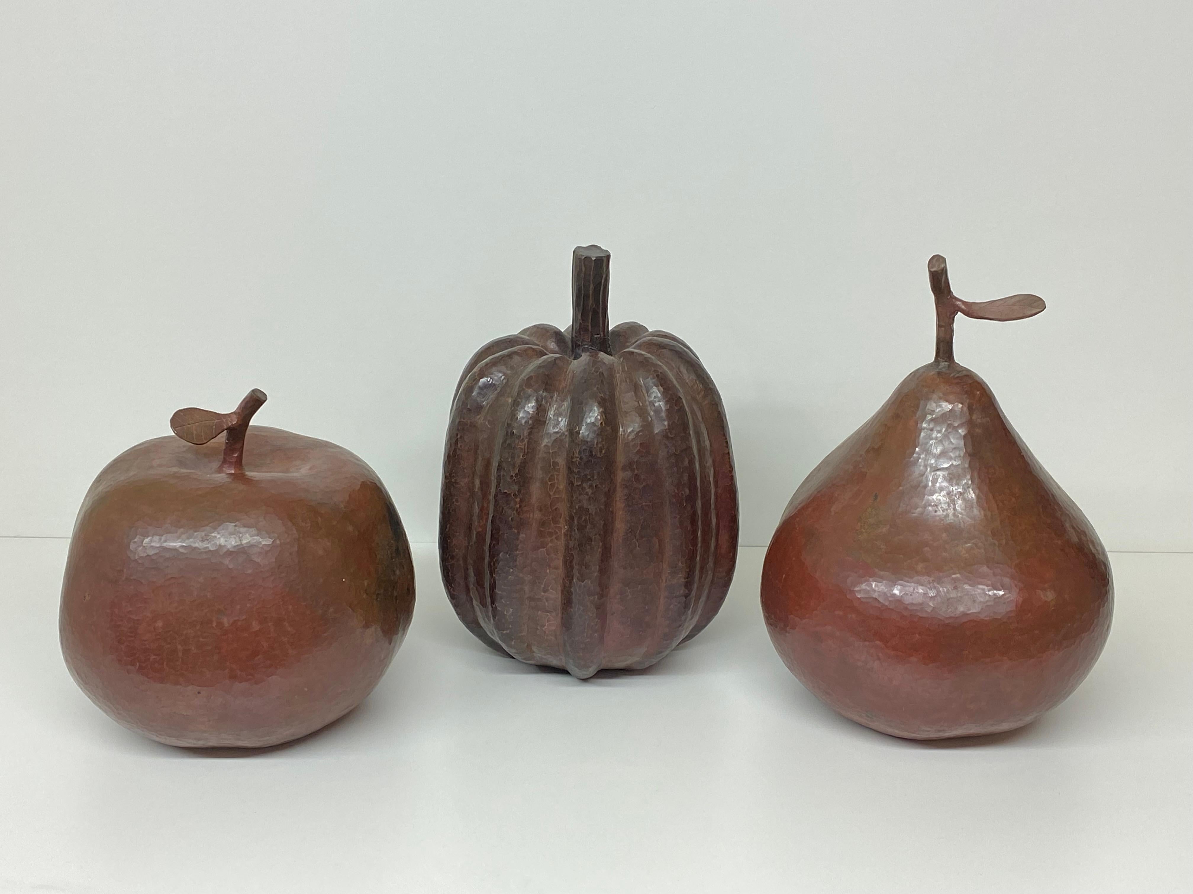 Set of three decorative hammered copper apple, pear and pumpkin sculptures in the style of Robert Kuo. Apple is 8