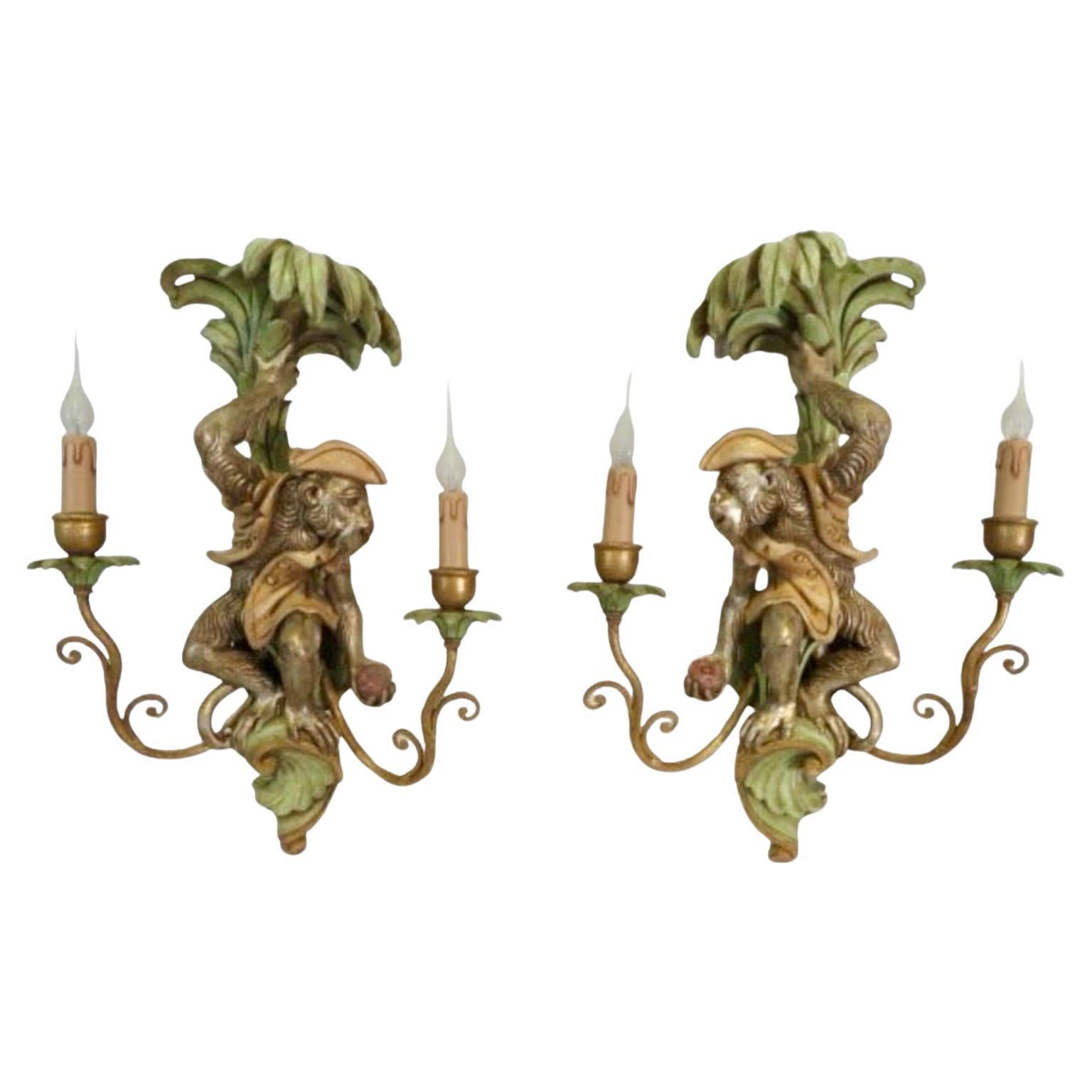 This is a fabulous pair of Regency style Italian carved wood and hand painted monkey in palm tree sconces by Decorative Crafts. They are in working order.