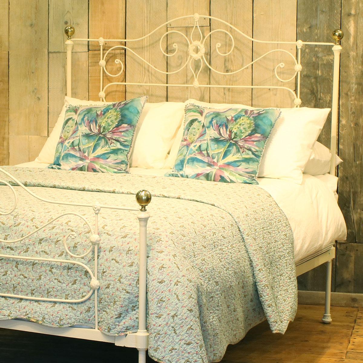 Antique bed in cream with decorative castings and delicate panels.

This bed accepts a UK King size or US Queen size (5ft, 60in or 150cm wide) base and mattress set.

The price includes a standard firm bed base to support the mattress. 

The