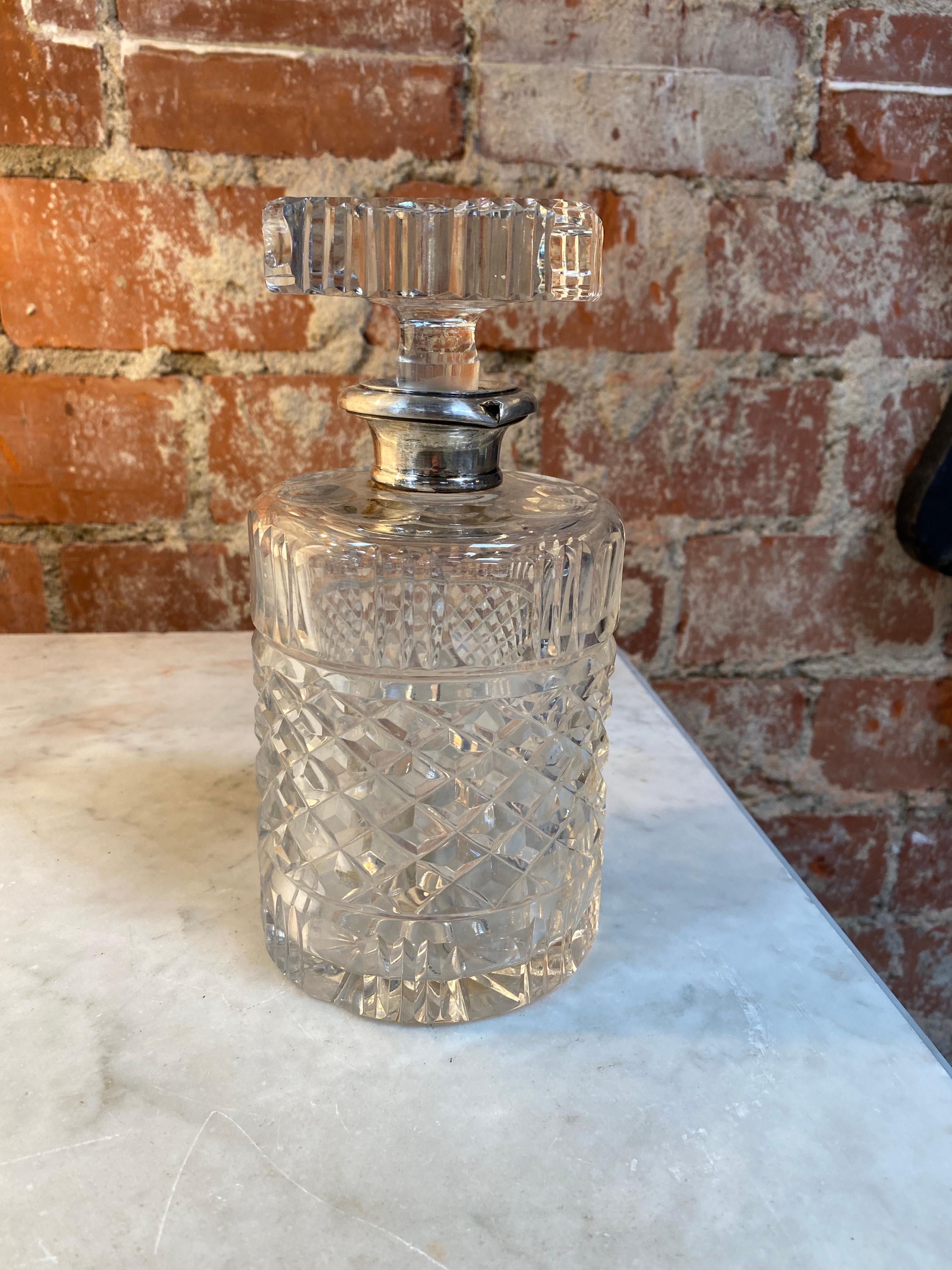 Decorative crystal bottle made in Italy, 1950s with silver detail.