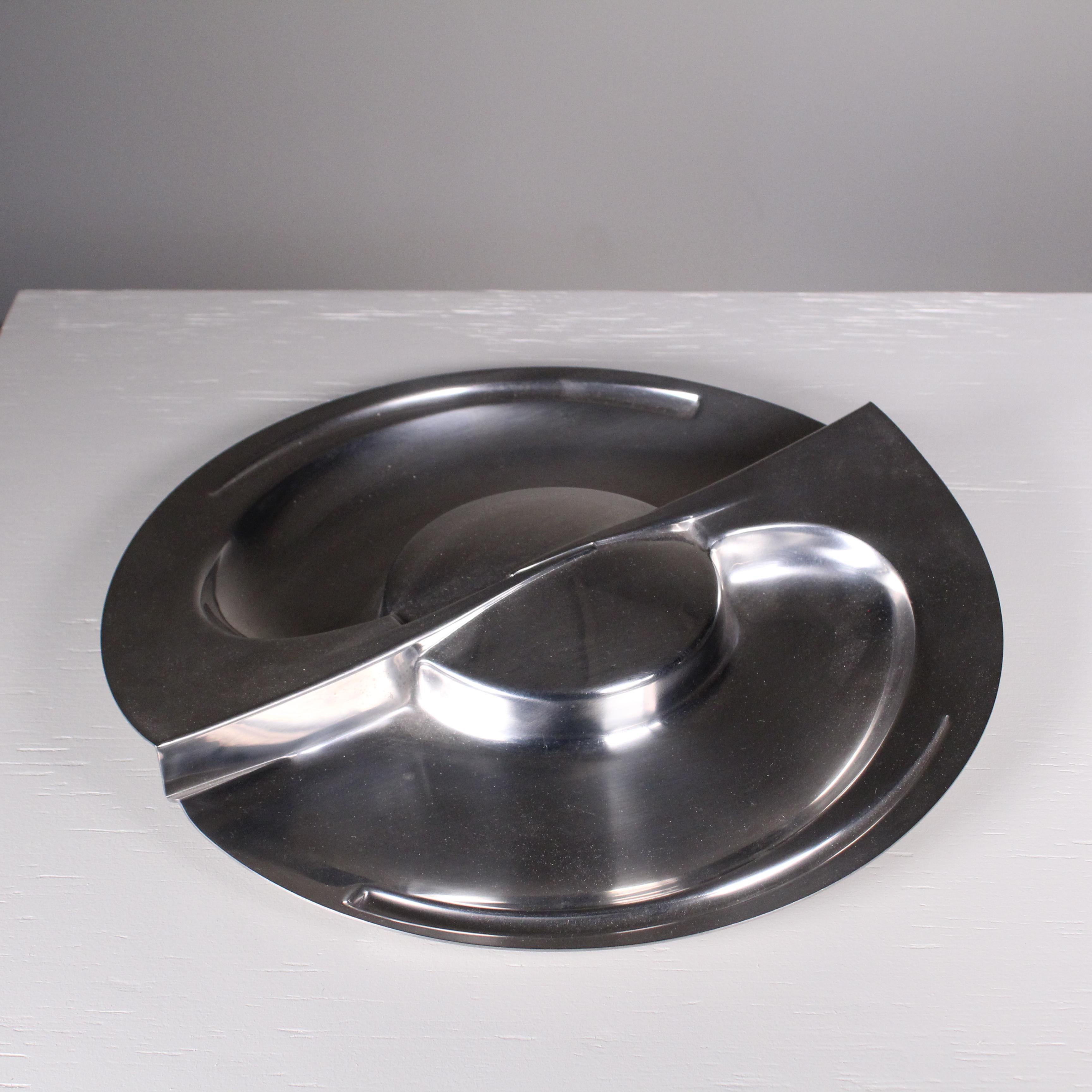 Steel centerpiece plate by Carmelo Cappello for Alessi in very good condition. 