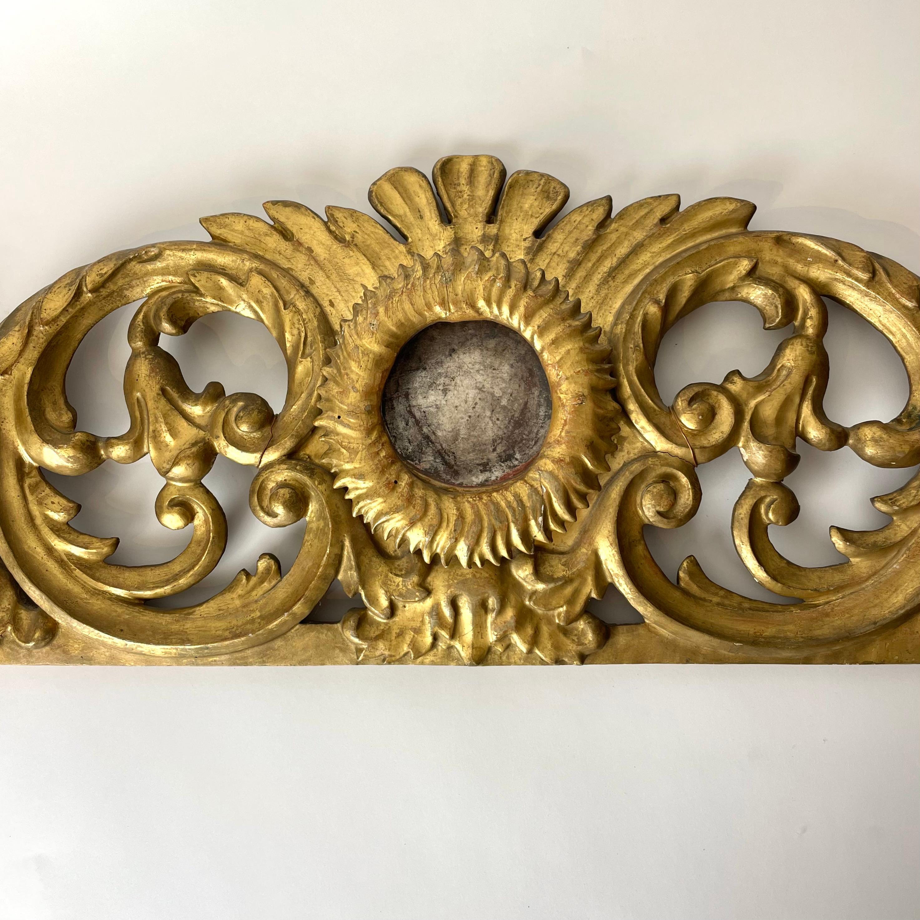 Beautiful Gilt and Silvered Door Moulding Architrave, 18th Century Rococo

This beautiful top door header moulding features intricate detailing in typical Rococo fashion, in the form of flowing leafs in gilt and silvered wood. At the center is a