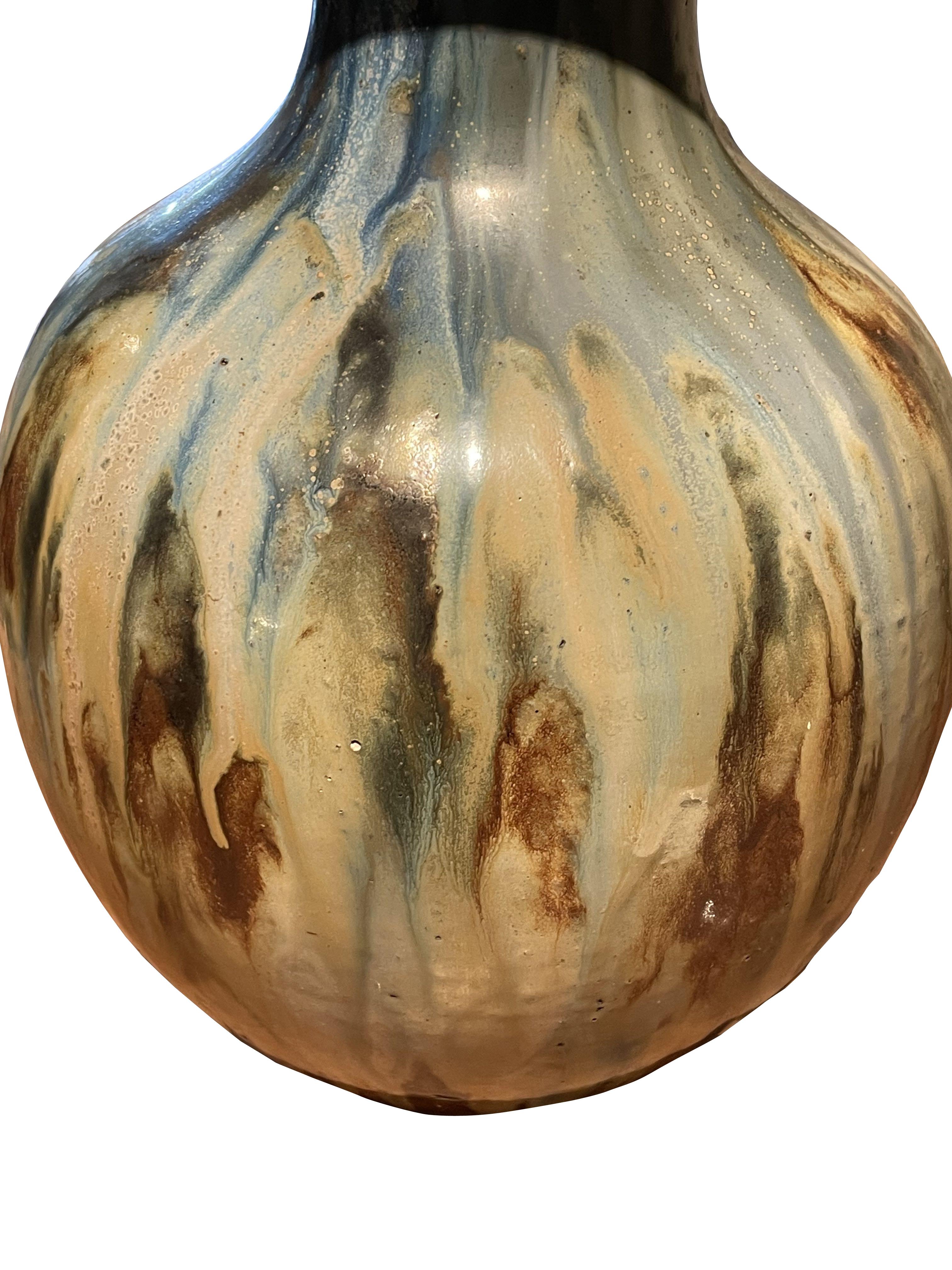 1920's Belgian Roger Guerin ( 1892 - 1954 ) signed drip glaze  stoneware vase.
Guérin was known largely for his Modernist experiments with salt glaze techniques, and after winning a medal at the Paris Exposition des Arts Décoratifs in 1925, was