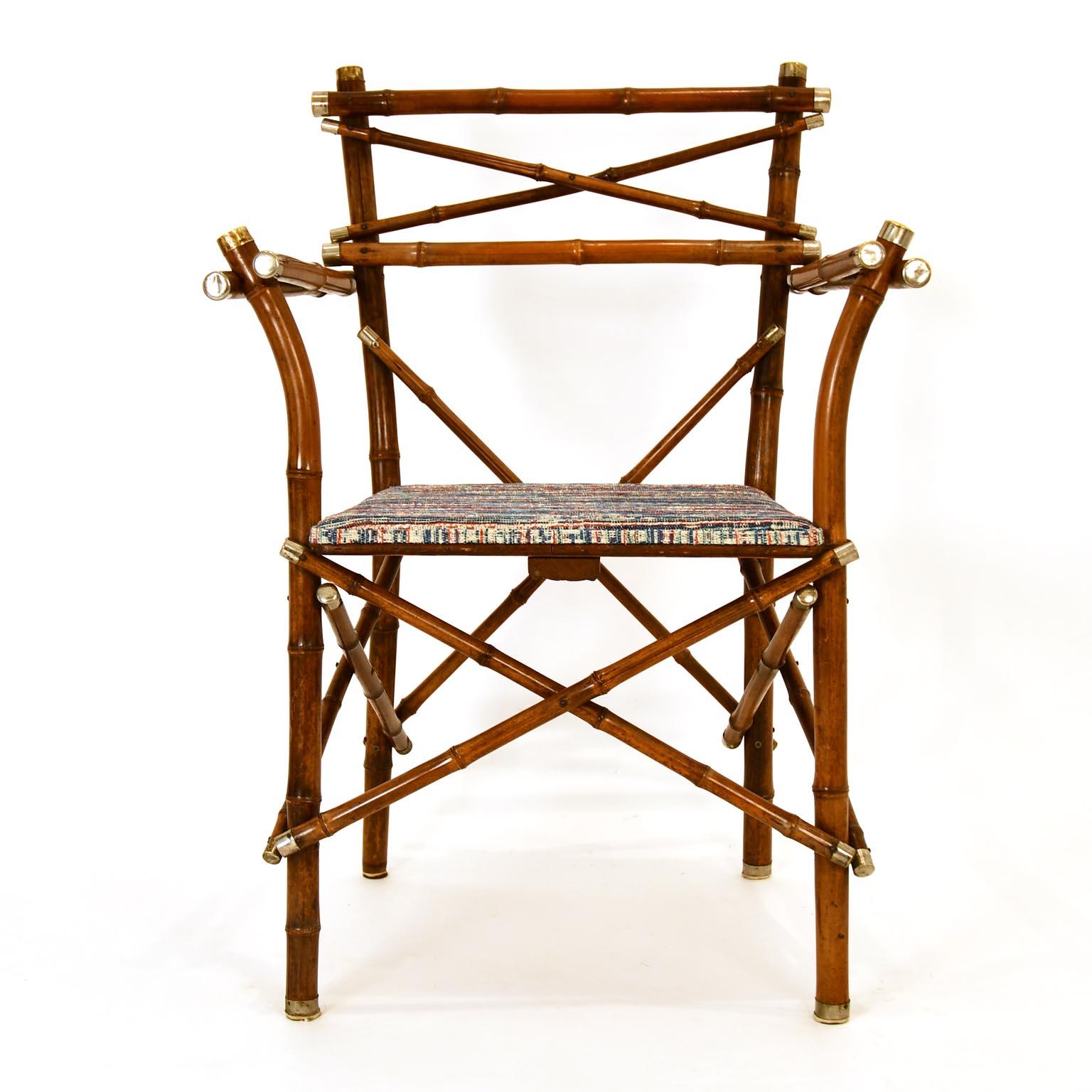 A decorative pair of bamboo armchair which was made in Vienna circa 1920 by J. Kothgassner - Bambus & Phantasie-Möbel, Gumpendorferstrasse 57.
The end of the bamboo rods have a nickel plated brass cup. One chair has 3 missing cups at the feet, the