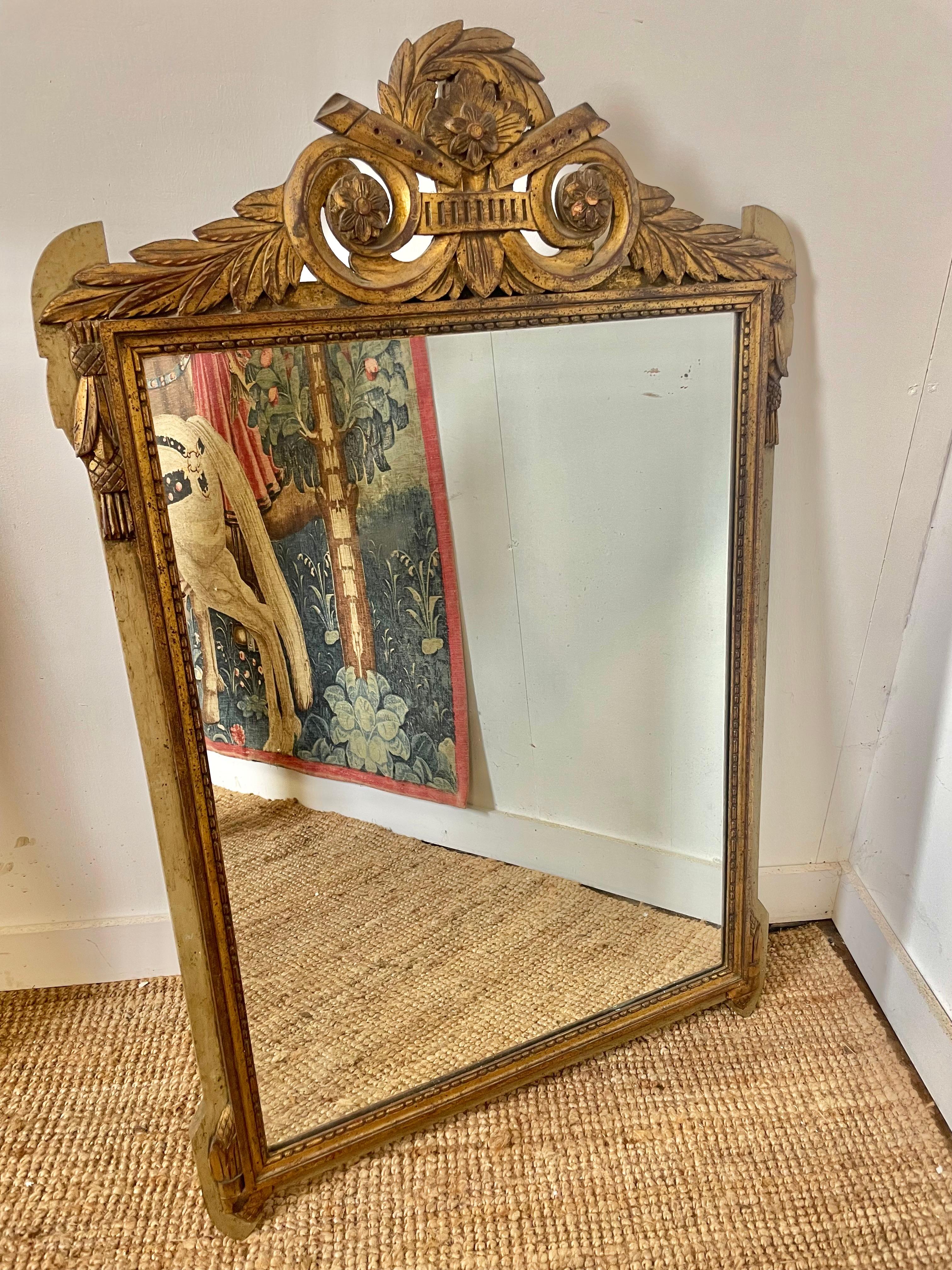 Early 20th century Gilt and painted mirror in the Louis XV style 

French circa 1930's 

Height 46 inches or 117 cms  

Width 30 inches or 77 cms 