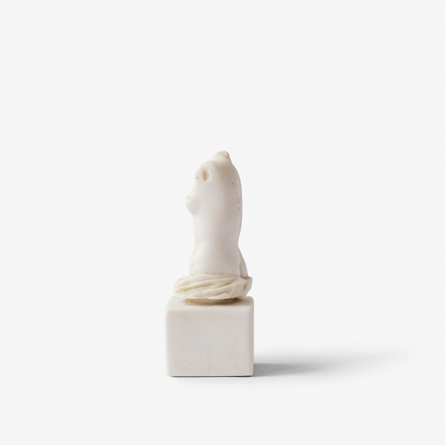 Bring the timeless elegance of classical antiquity into your space with this sculptural female torso, inspired by Greco-Roman art traditions. In art history, a torso refers to a sculpted representation of the human body-absent of arms, legs, and