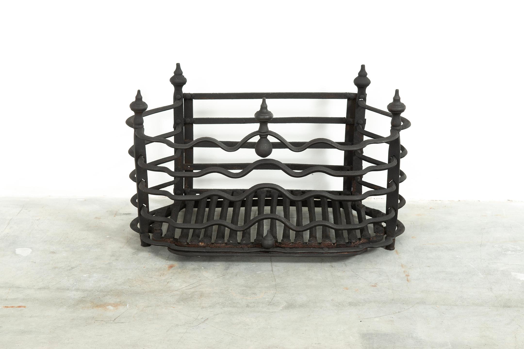 Very decent sized French firegrate or fireplace basket.
The elegant shaped wrought iron bars and rounded shape make this a pleasure to look at.

Very good and usable condition, can be used in a real fire or to have a gas insert installed.