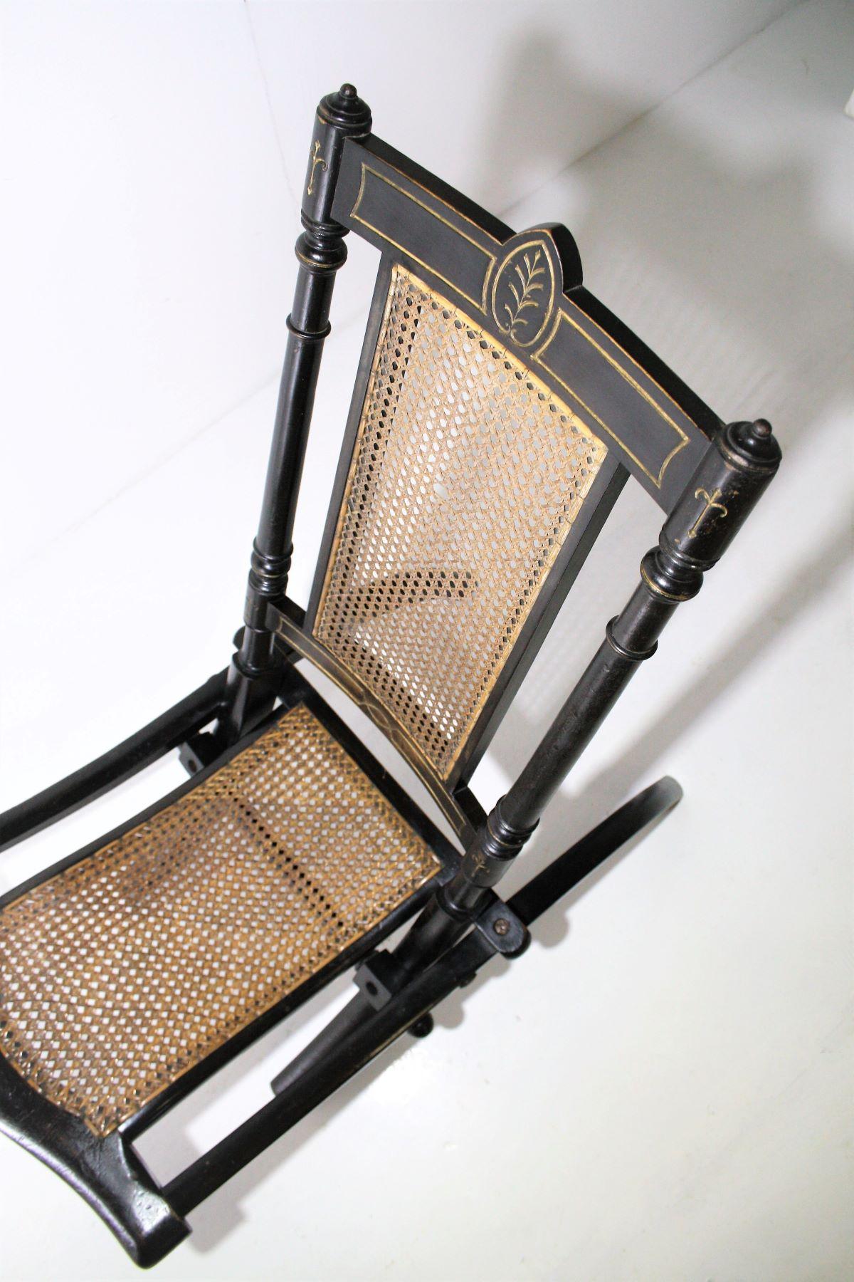 Early Victorian Decorative Folding Victorian Chair with Cane Seat Ebonised with Gilt detailing