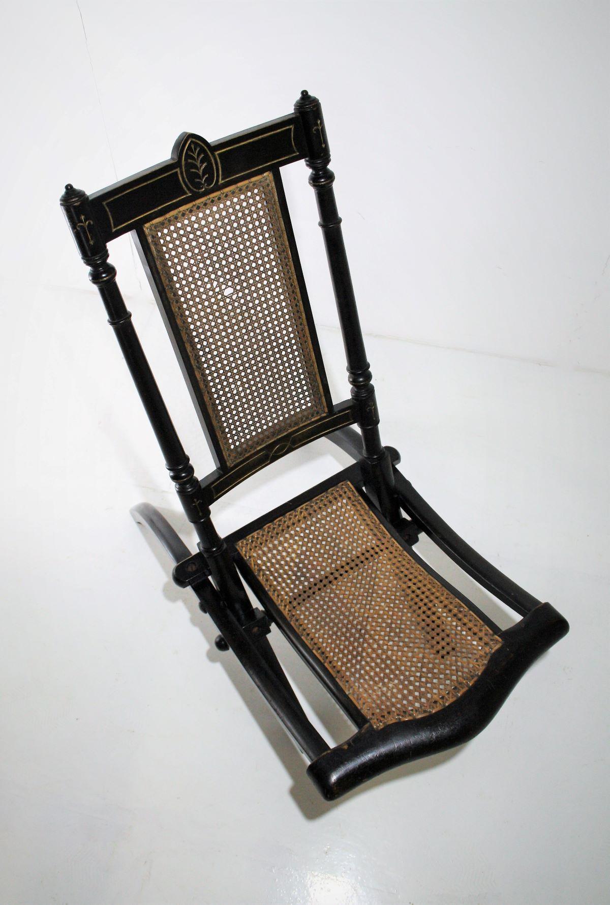British Decorative Folding Victorian Chair with Cane Seat Ebonised with Gilt detailing