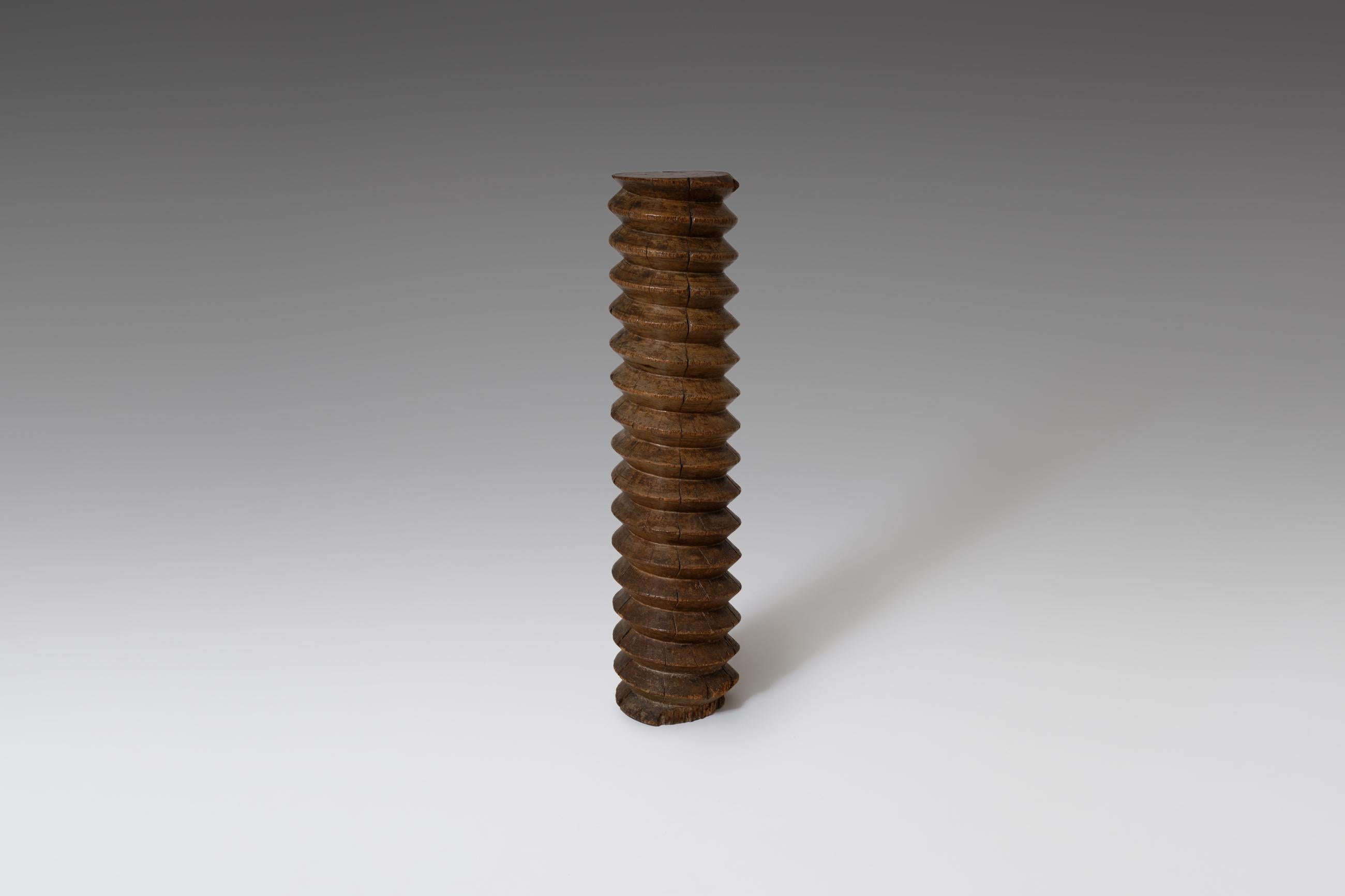 French hand carved wooden press, France, mid-19th century. The screw has been part of an old wine press and is hand carved out of solid walnut. Highly decorative object. In very good original condition with a lovely characteristic patina.