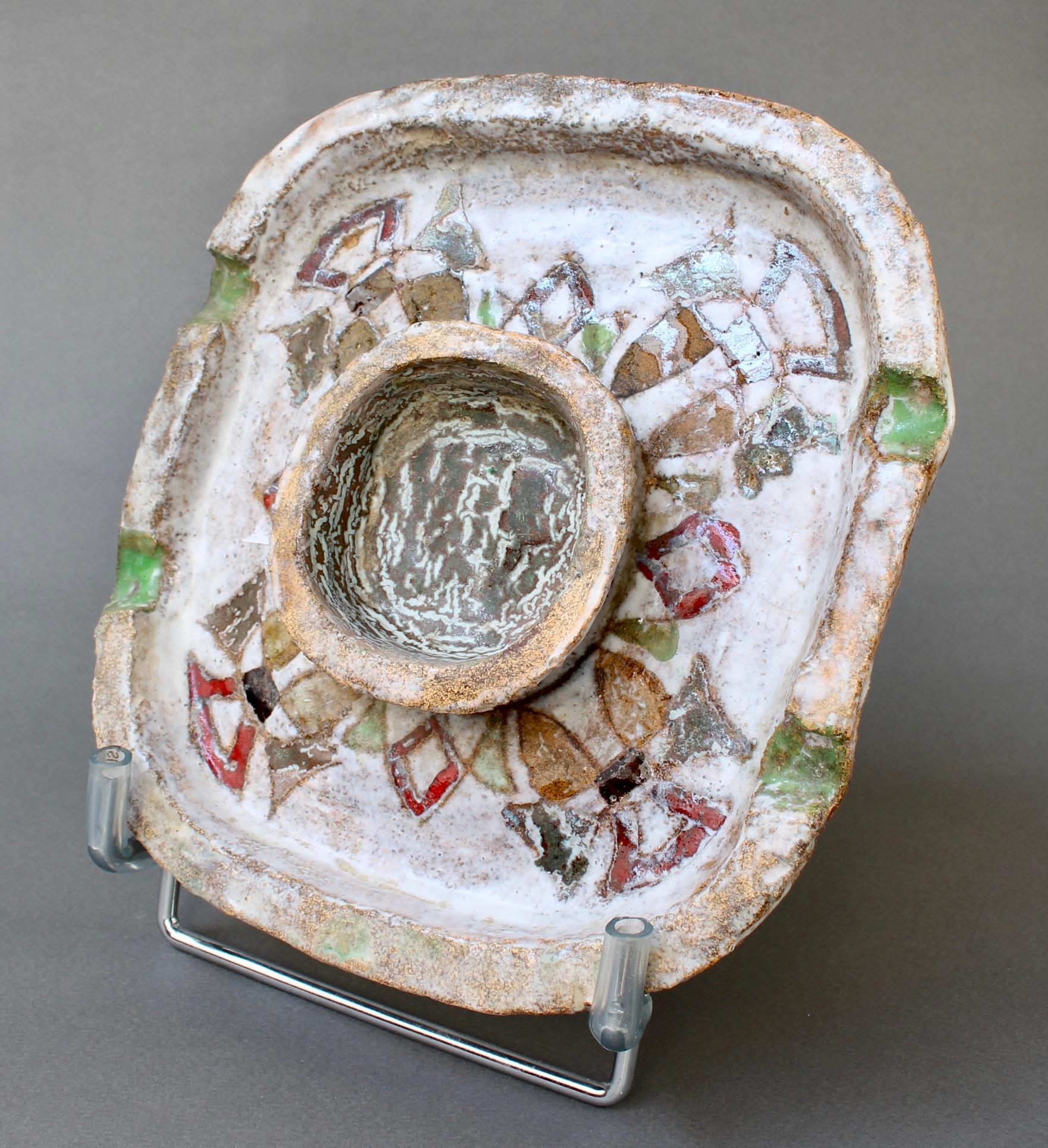 Decorative French vintage ceramic ashtray / vide-poche by Fernande Kohler, Vallauris (c. 1960s). Chamotte earthenware rounded-square form accented by hand-decorated coloured enamel in various geometric shapes. Rustic in appearance with Southern
