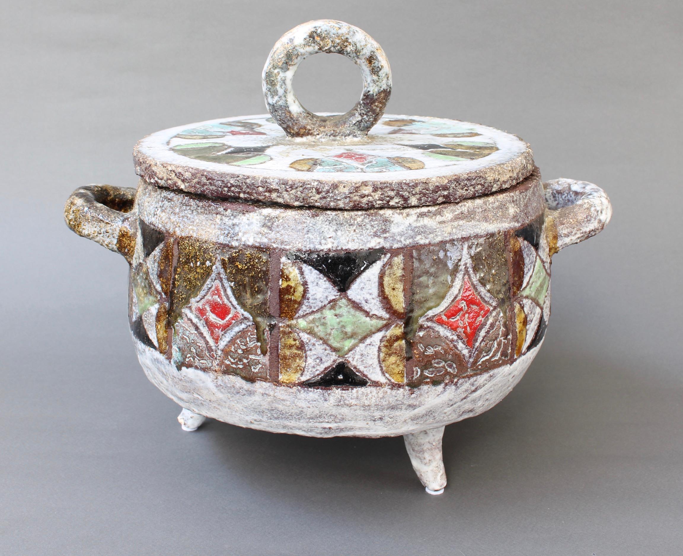 Decorative French ceramic tureen by Fernande Kohler (c. 1960s). Fired Chamotte clay forms the structure of this delightful soup tureen and table centrepiece. The earthenware is accented both on the base and the lid by hand-decorated coloured enamel