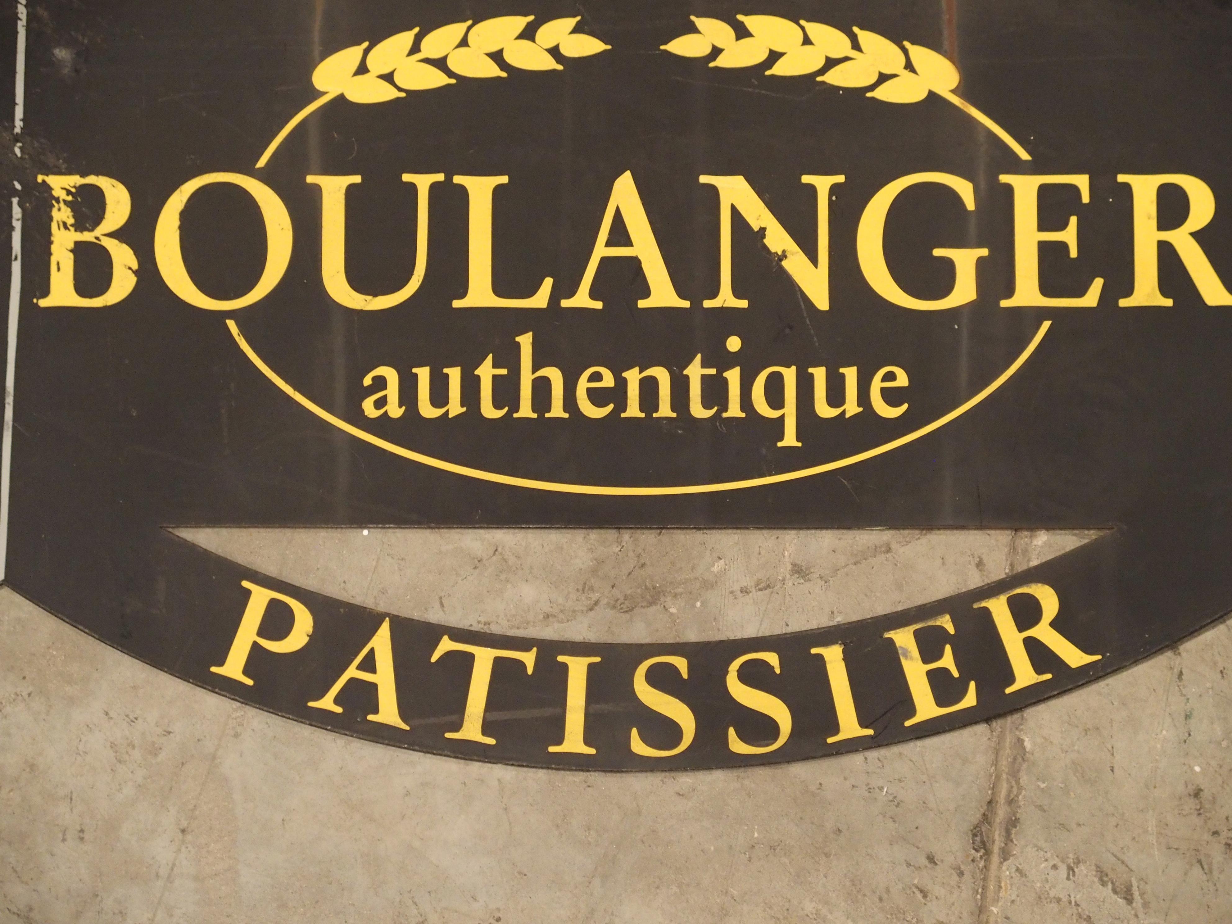 This black painted French boulangerie sign would be perfect in a restaurant or large country kitchen. The vertical bracket which bolts into the wall is comprised of a farm spade, while the arm that extends outward features an entire scene made of