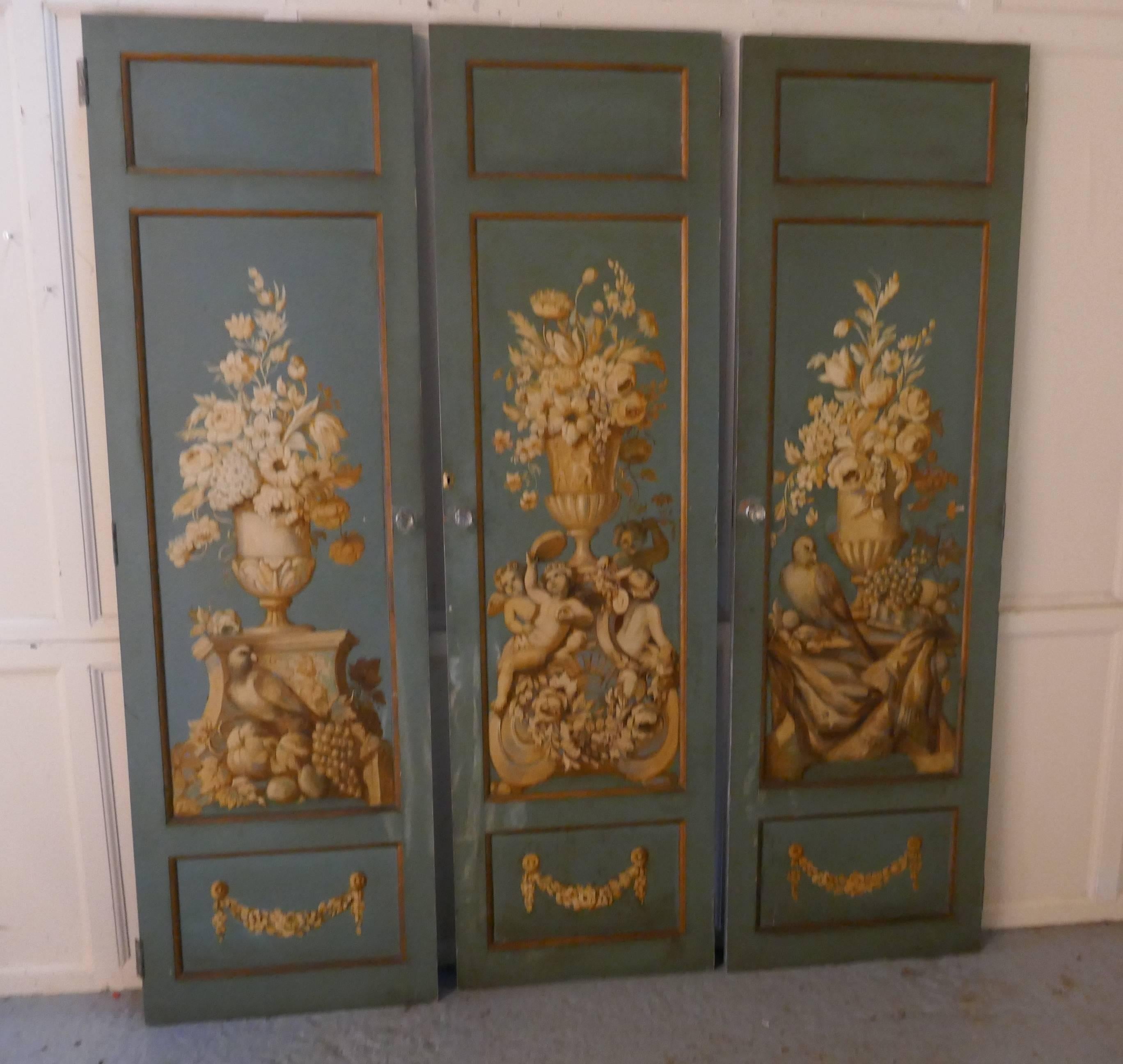 Decorative French painted doors

This is a very attractive trio of mid-19th century painted panelled doors, the have come from a piece of furniture like an armoire.
The doors have been hand painted with urns, birds and cherubs with plentiful