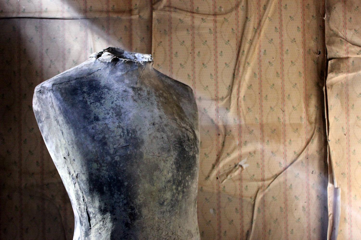 The well proportioned compressed paper and card mannequin form, for the shop window display of garments, its surface now bearing a superb aged patination in a myriad of greys, turquoises and vergris, surviving from early twentieth century