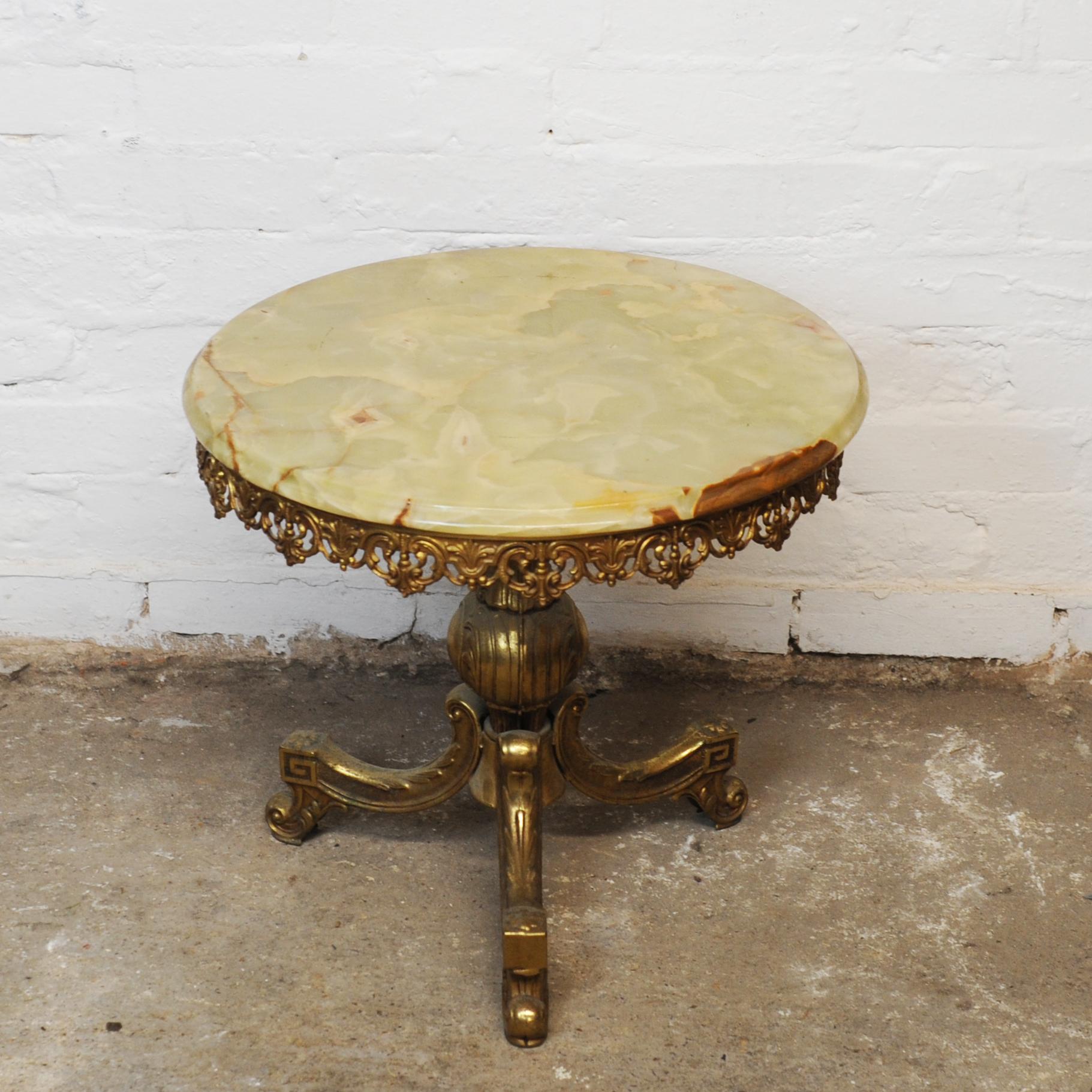 A round side table with green marble which sits on a brass metal frame.

Designer - Unknown

Design Period - 1970 to 1979

Detailed Condition - Good with minimal defects. 

Restoration and Damage Details - Light wear consistent with age and