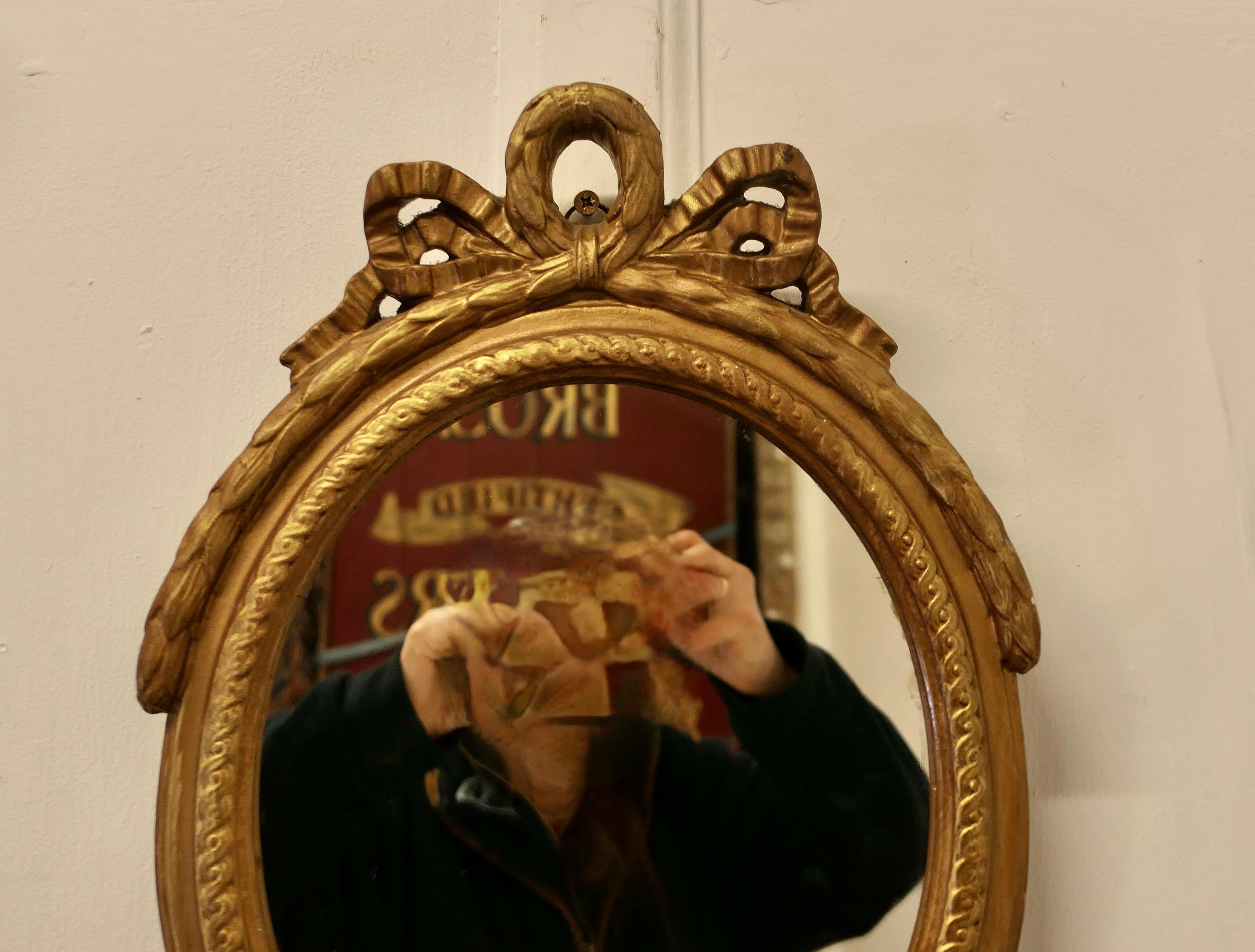 Early 20th Century Decorative Gilt Oval Mirror    For Sale