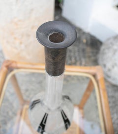 Bouteille décorative en verre avec couvercle en argent